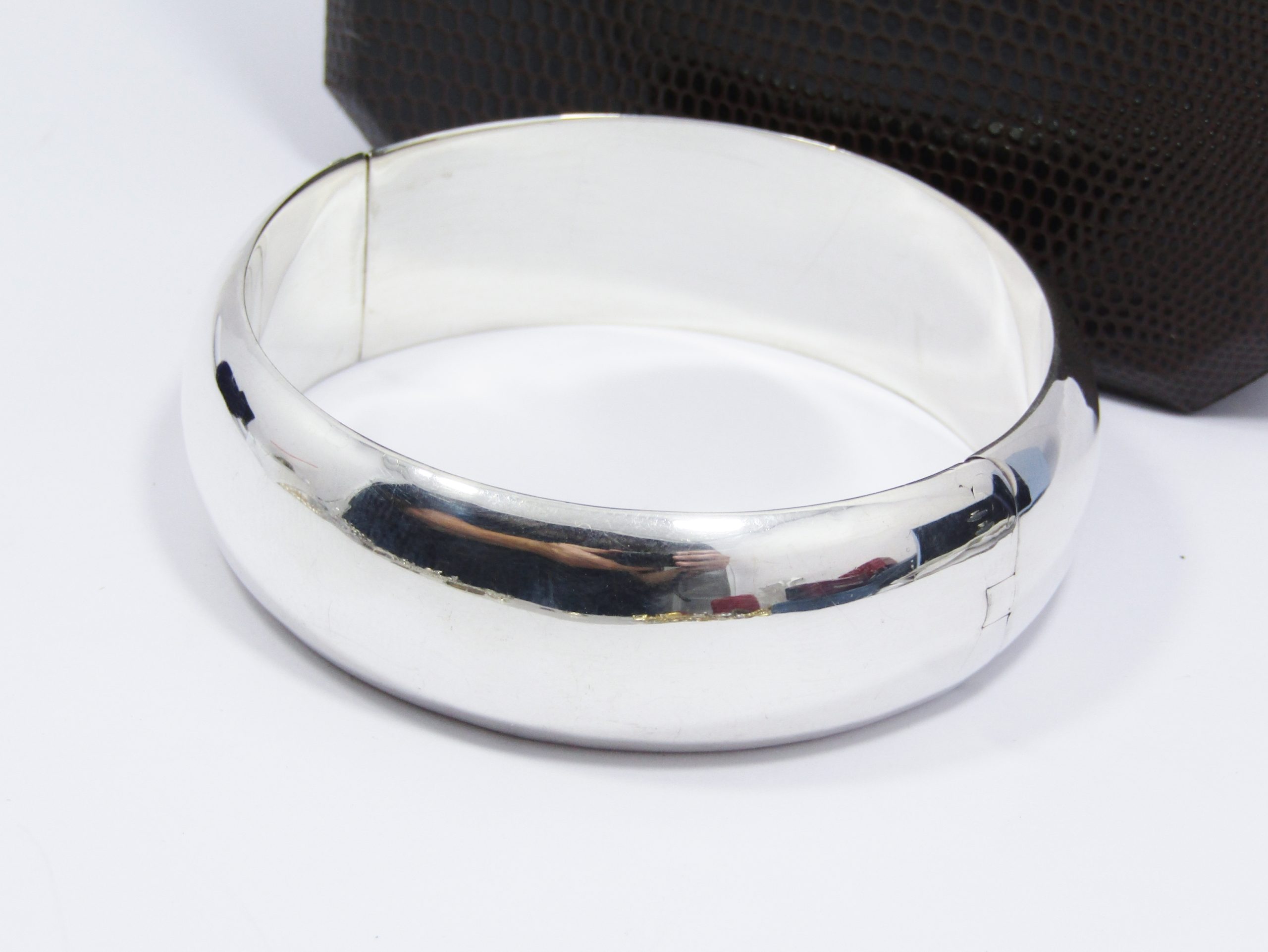 A Beautiful Broad Hinged Bangle in Sterling Silver