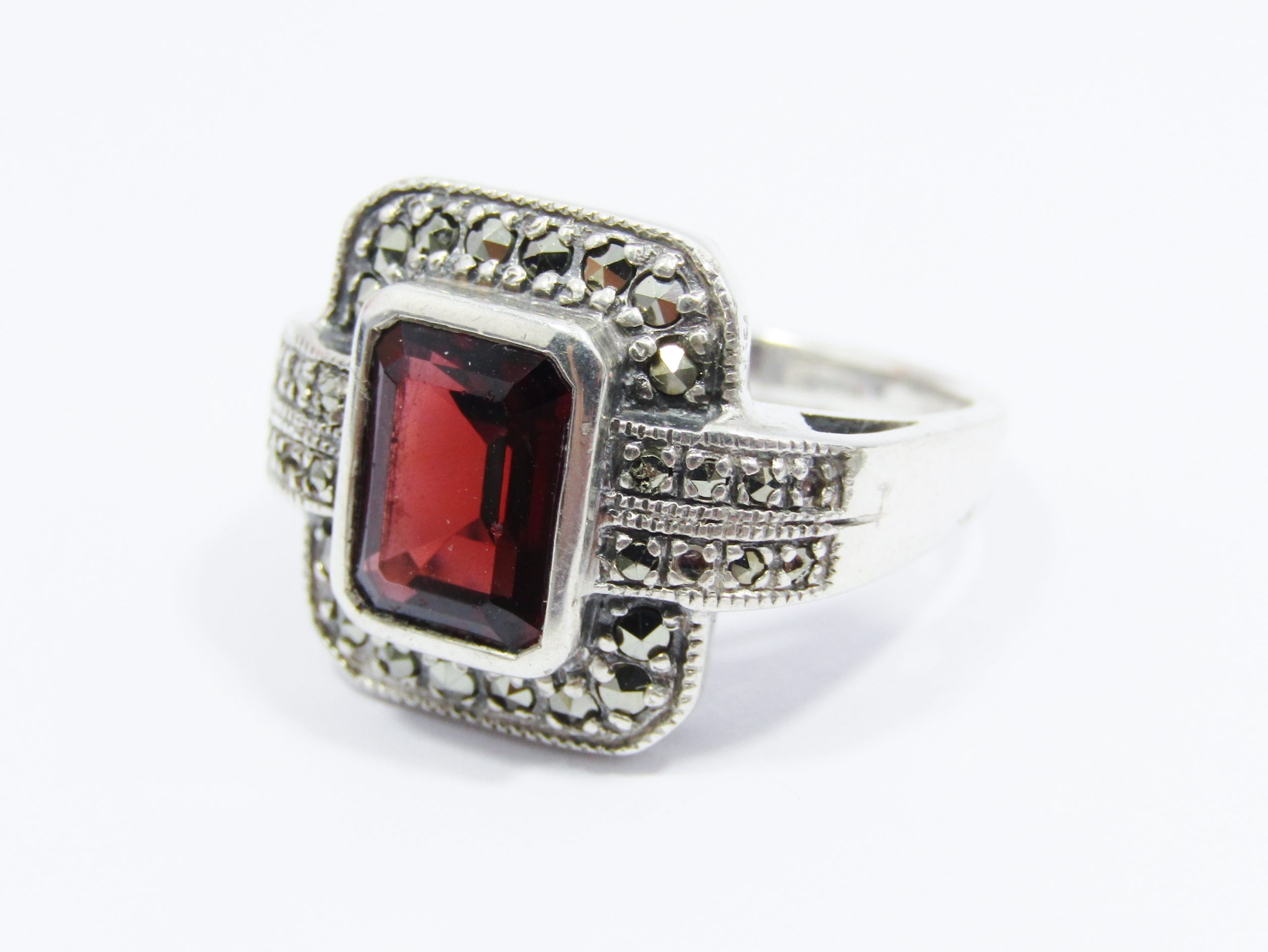 A Beautiful Vintage Design Garnet Ring Surrounded With Marcasite's IN Sterling Silver