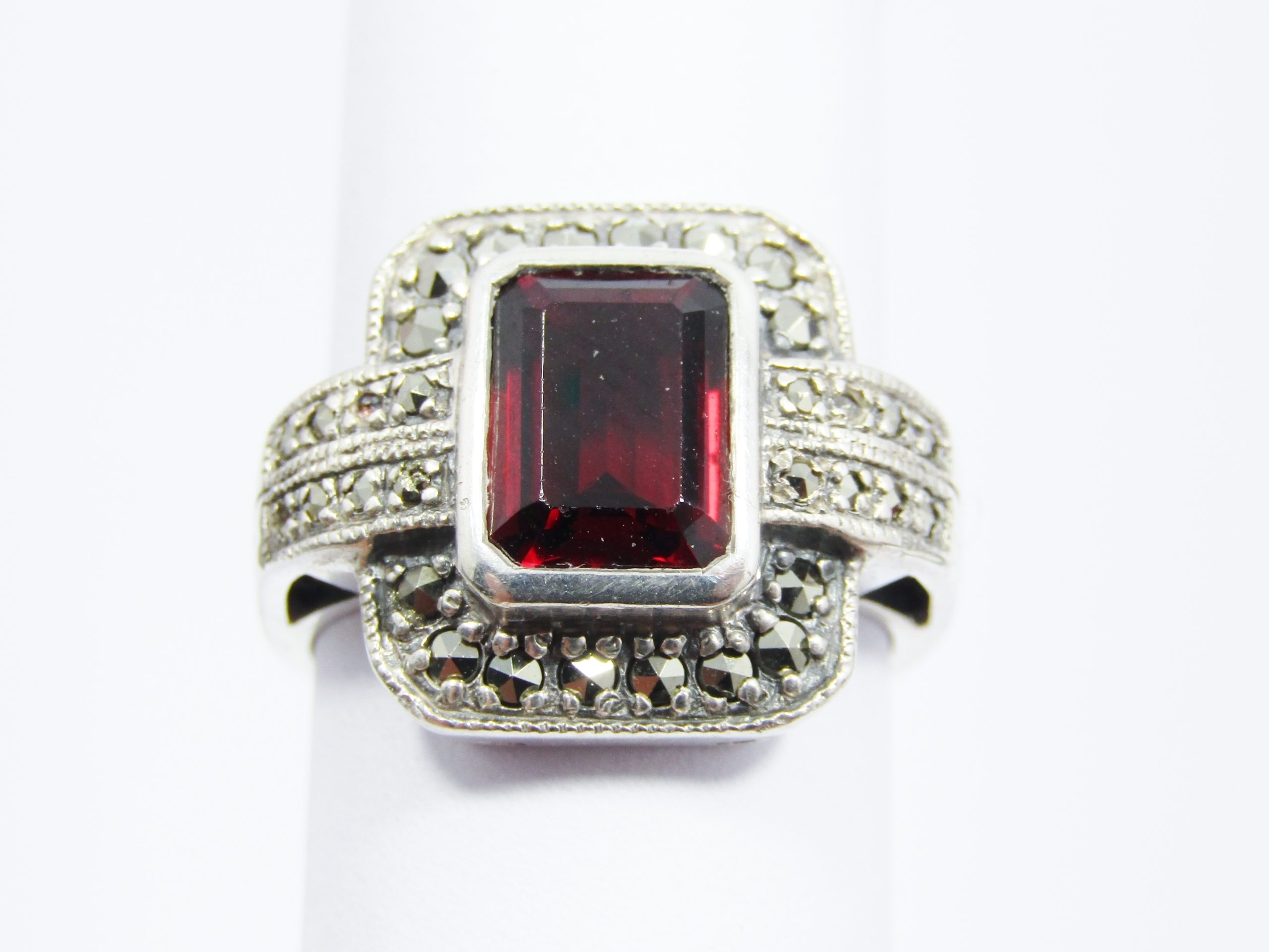 A Beautiful Vintage Design Garnet Ring Surrounded With Marcasite's IN Sterling Silver