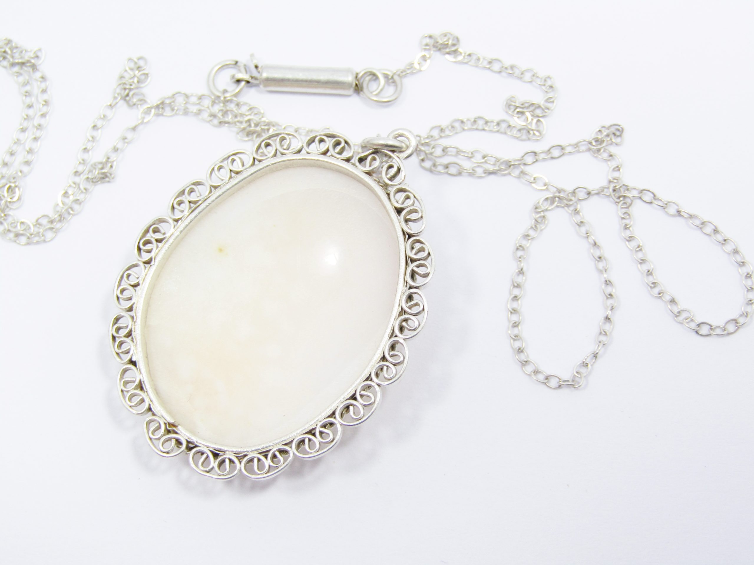 A Gorgeous Large Vintage Carved Pendant On chain in Sterling Silver