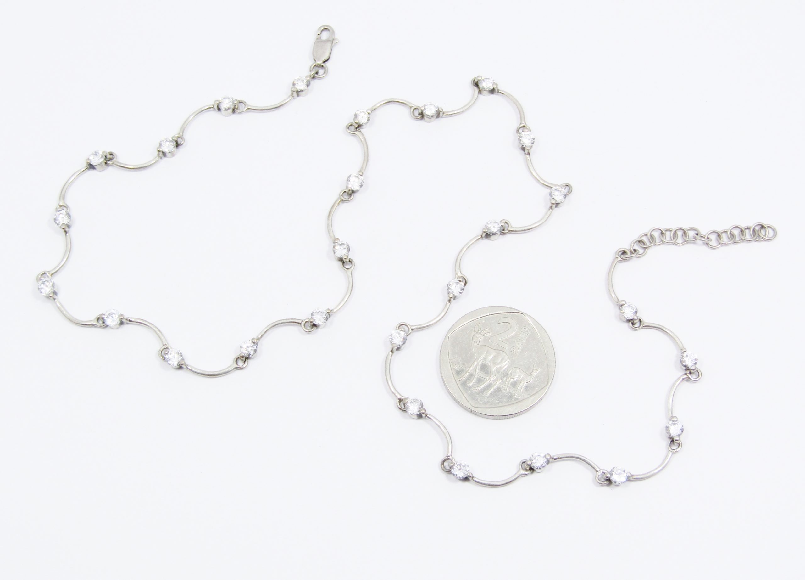 A Stunning Scallop Design Necklace Dotted with Clear Zirconia's in Sterling Silver.