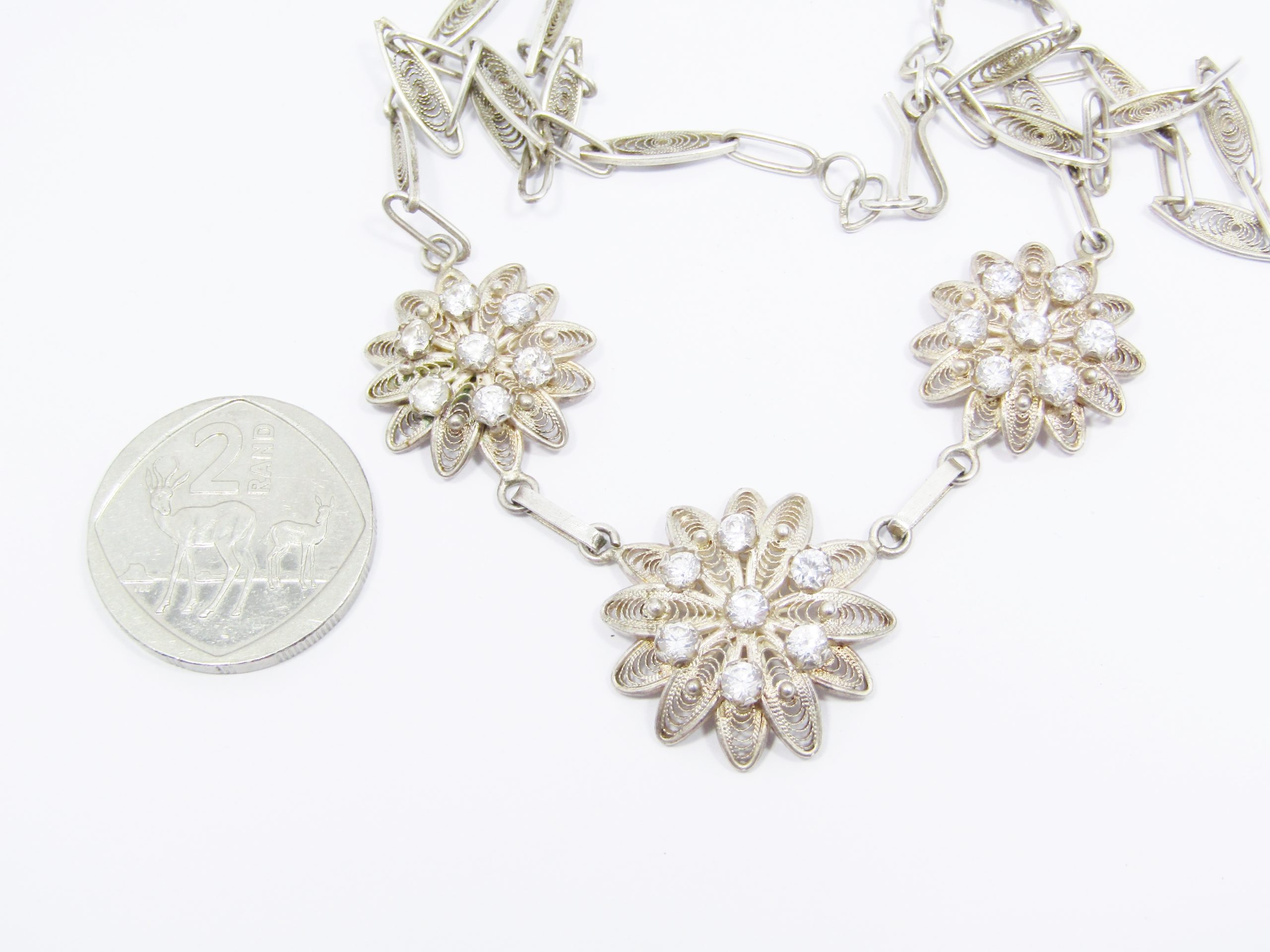A Lovely Filigree Flower Necklace Set with Tiny Clear Sones in 800 Silver