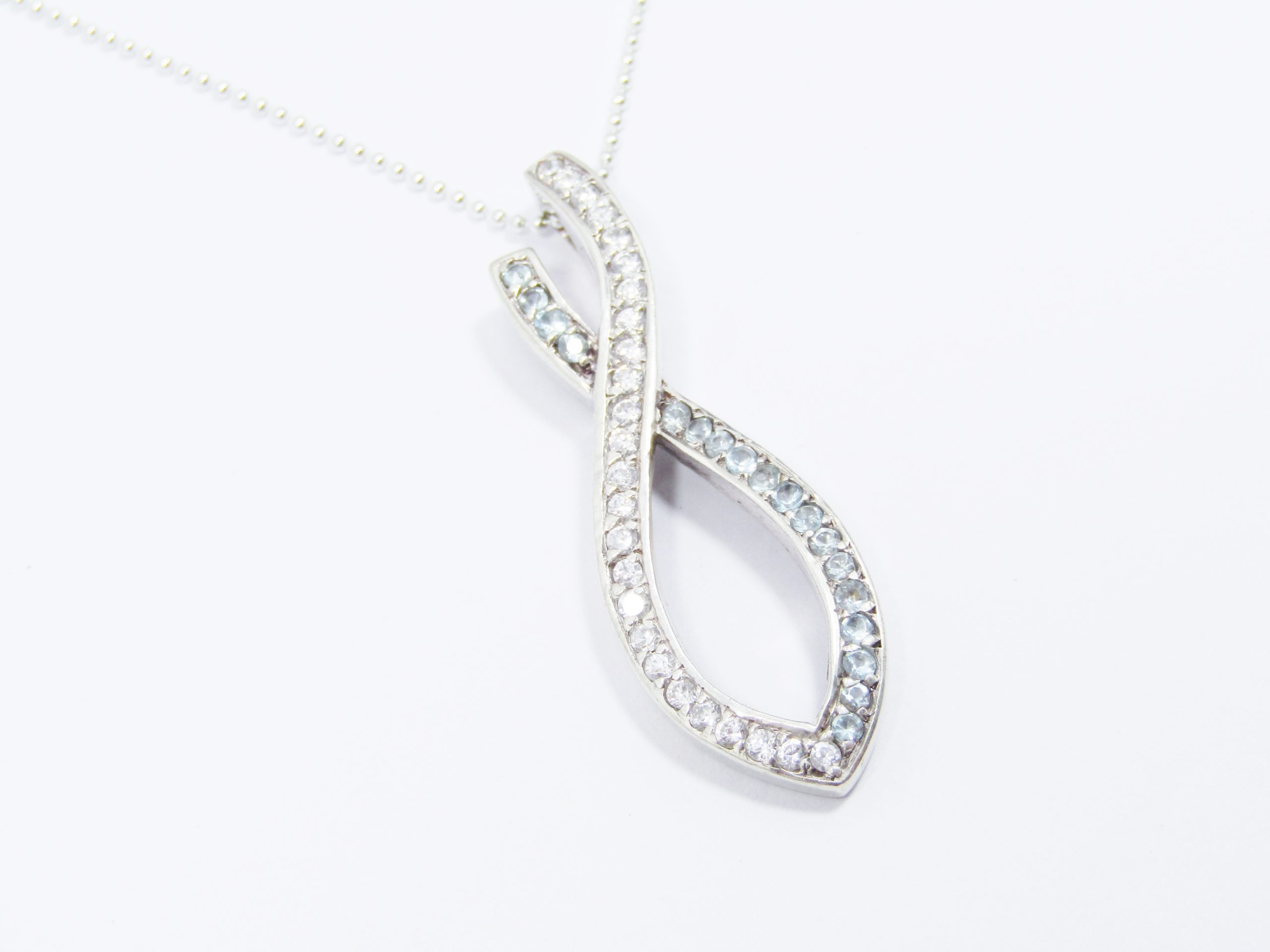 A Lovely Large Blue And White Zirconia Ribbon Pendant on Chain in Sterling Silver