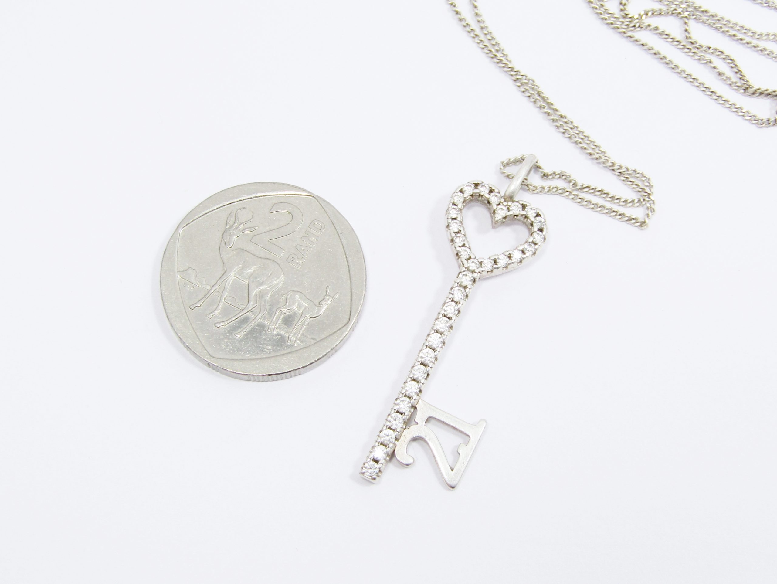 A Very Pretty 21st Key Pendant Encrusted With Zirconia on Chain in Sterling Silver