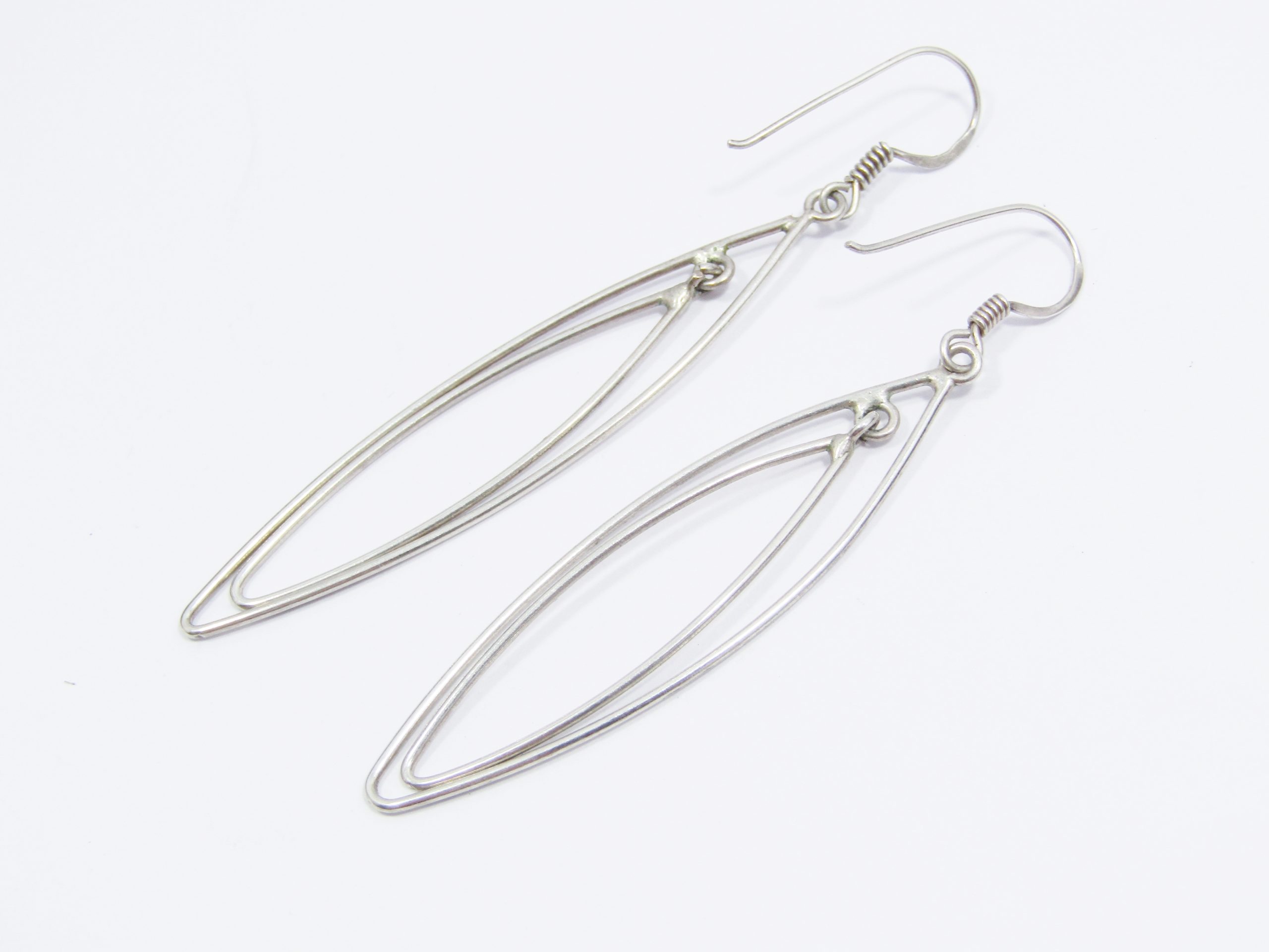 A Lovely Pair of Long Dangling Earrings in Sterling Silver.