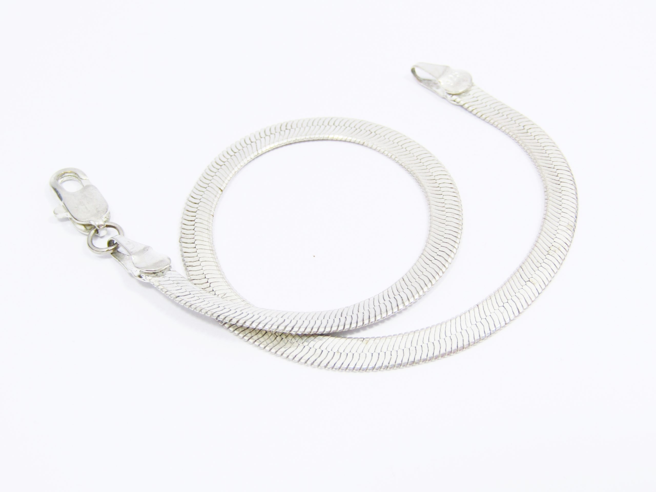 A Lovely Broad Herringbone Bracelet in Sterling Silver.