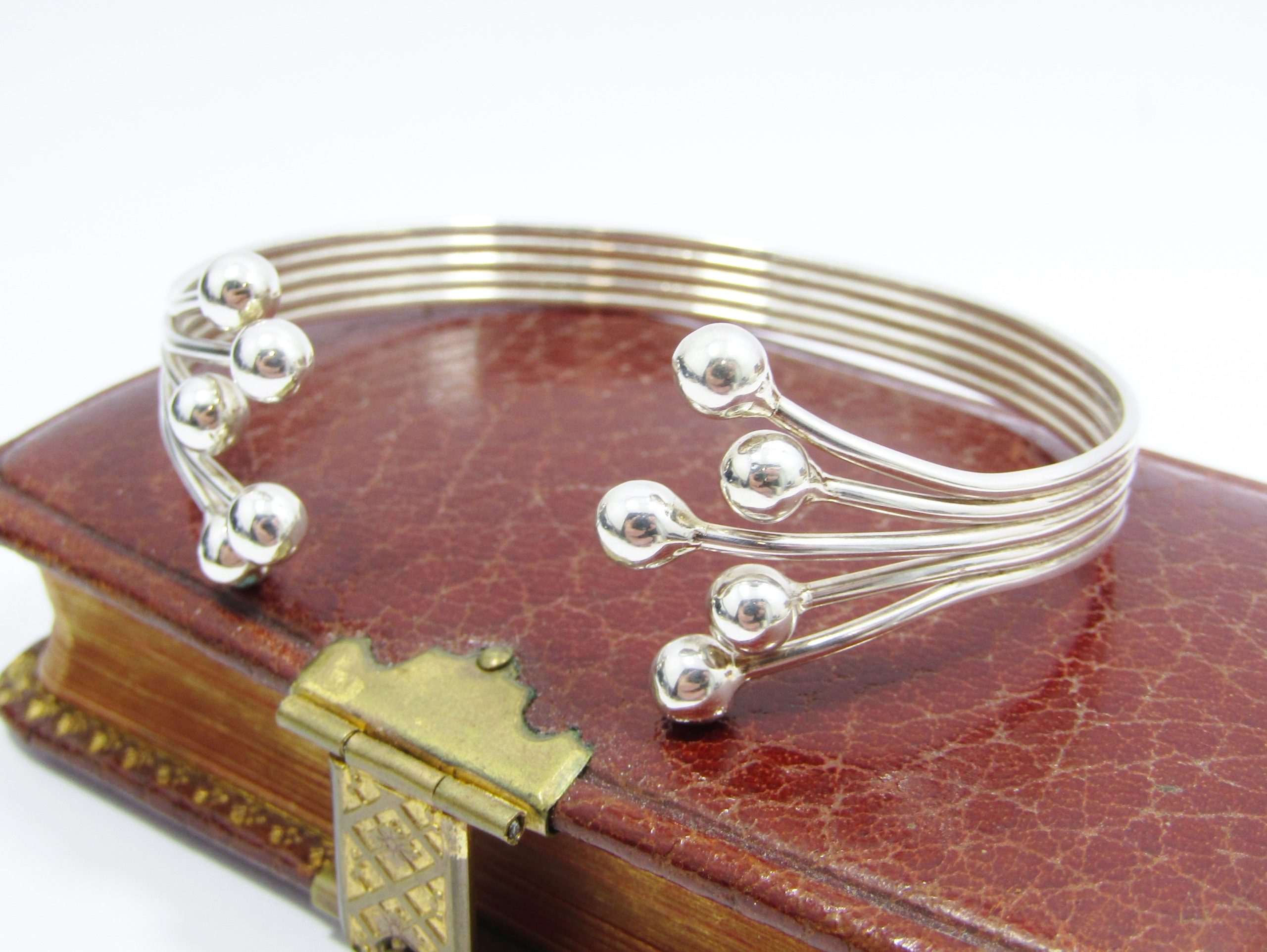 A Stunning Ball Design Cuff Bangle in Sterling Silver.