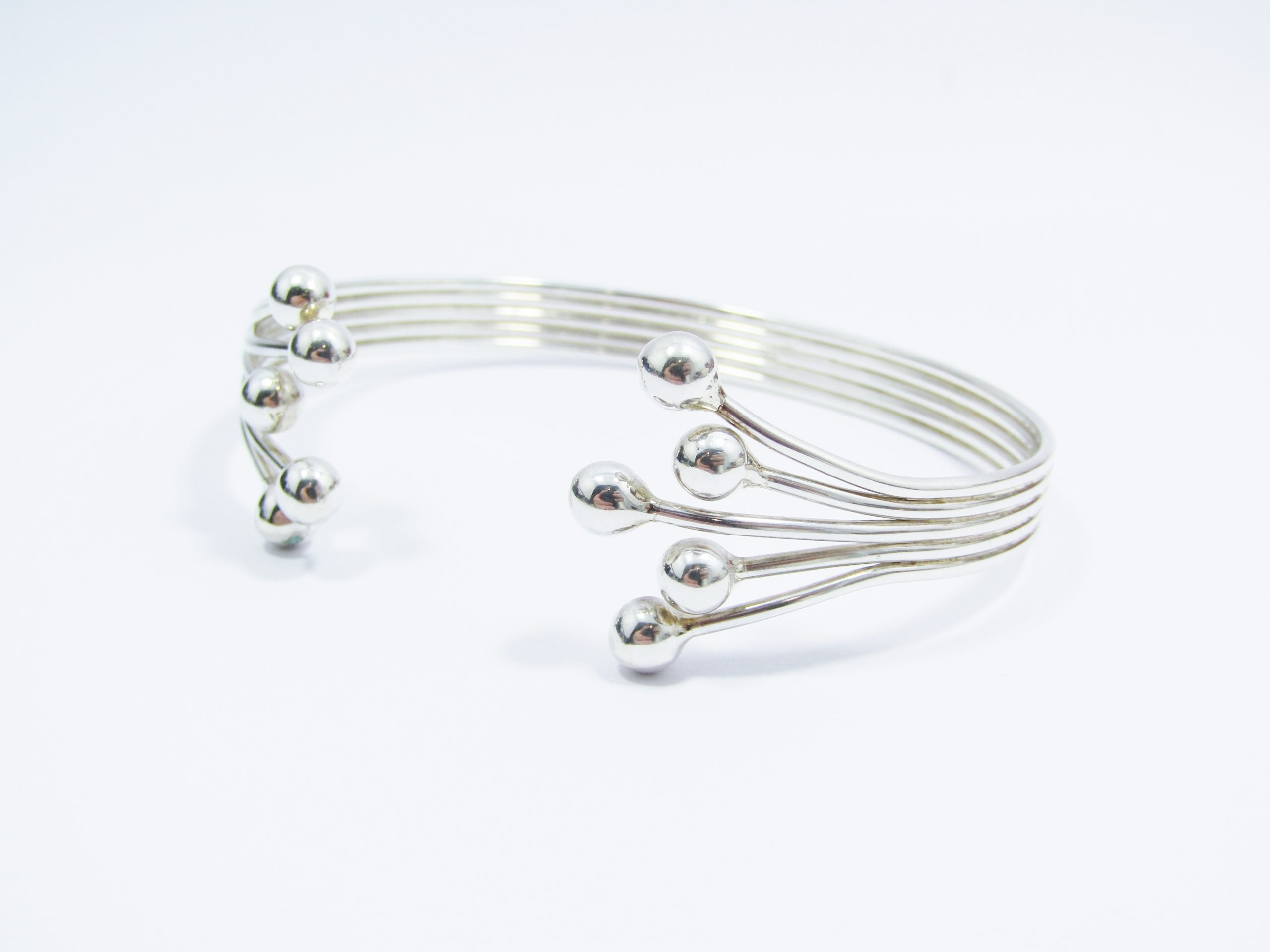 A Stunning Ball Design Cuff Bangle in Sterling Silver.