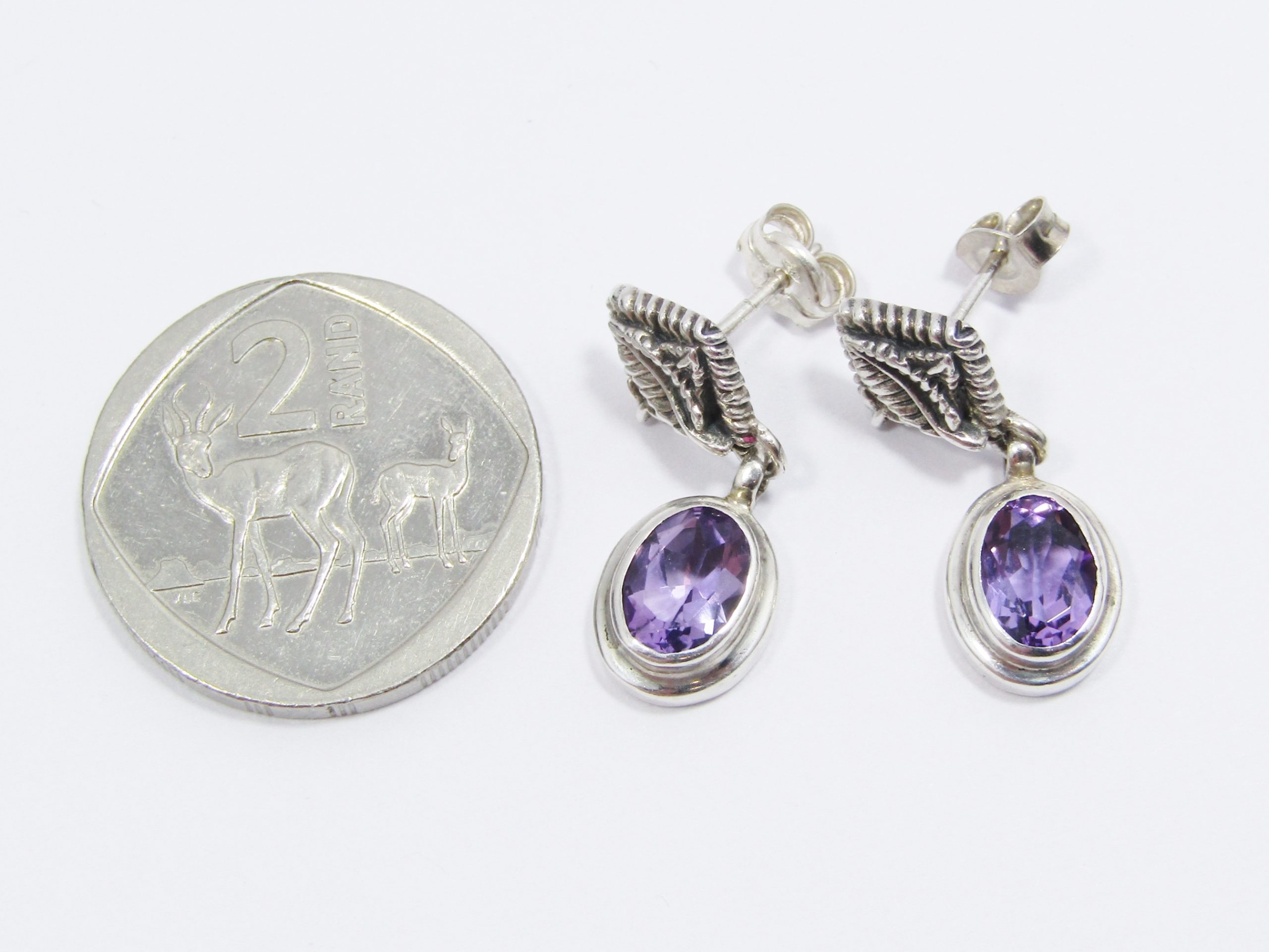 A Stunning Pair of Amethyst Dangling Earrings in Sterling Silver