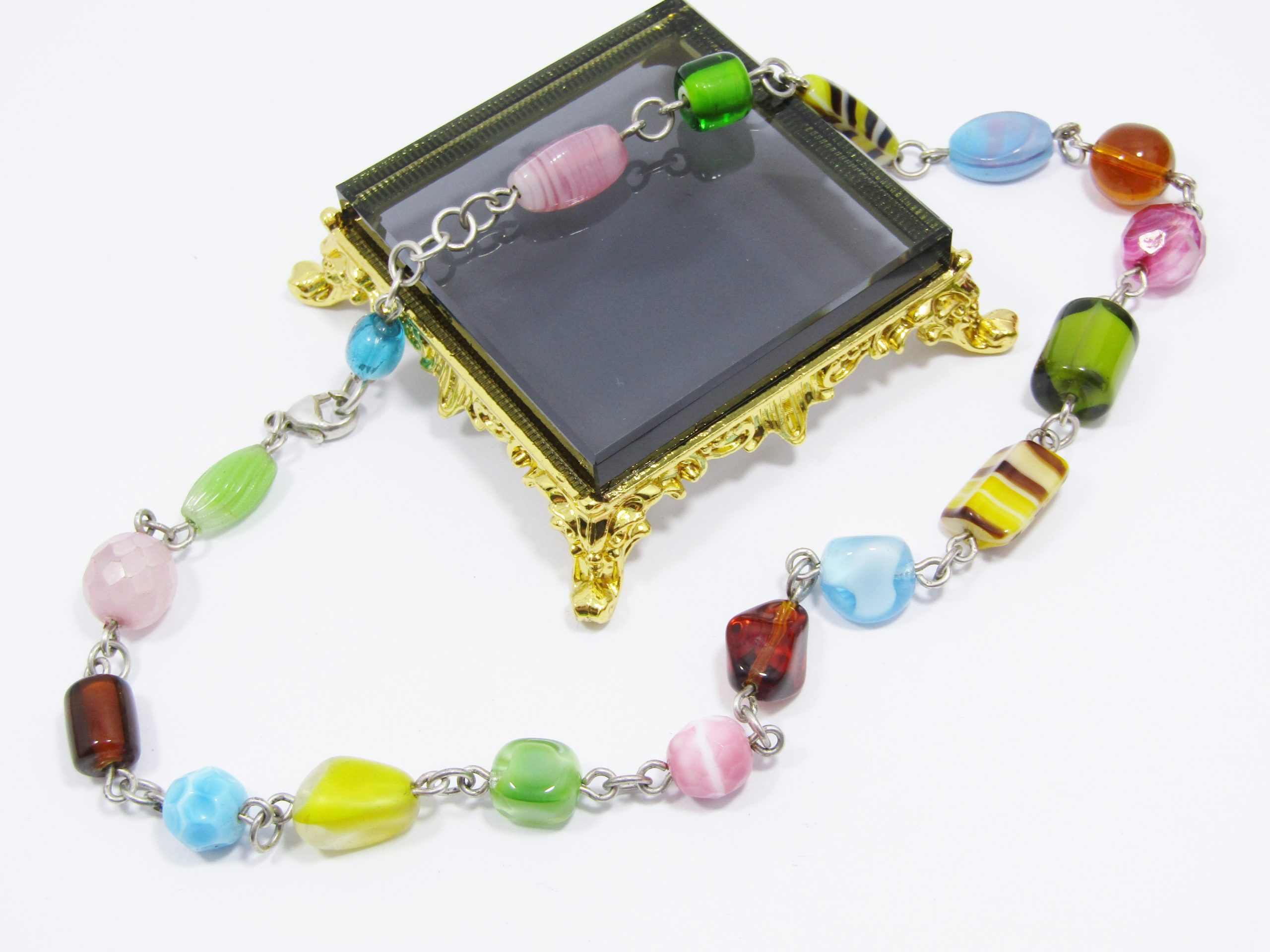 A Stunning String of Art Glass Necklace with Sterling Silver Links and Clasp