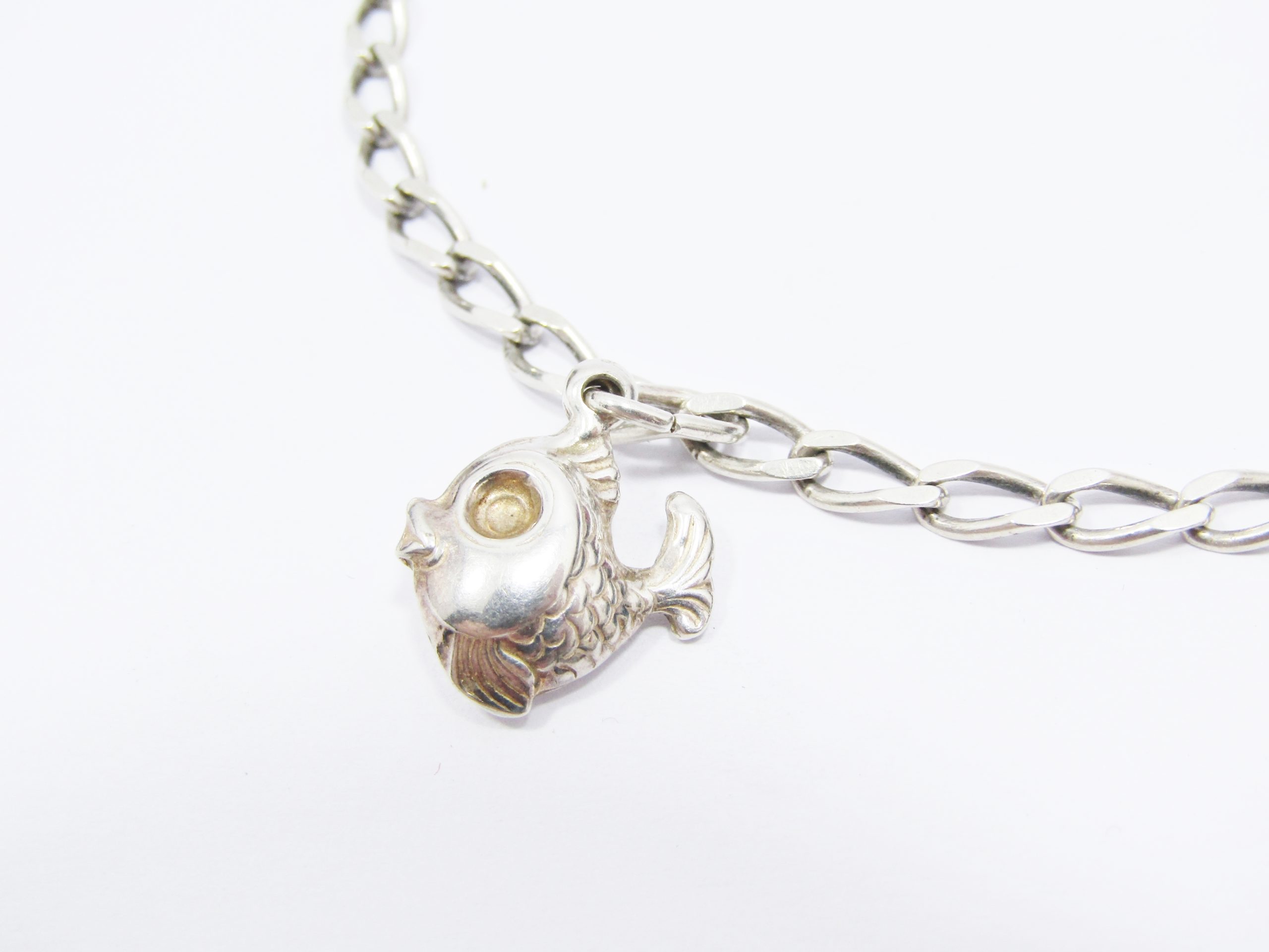 A Lovely Flat link Bracelet With a Puffy Fish Charm in Sterling Silver
