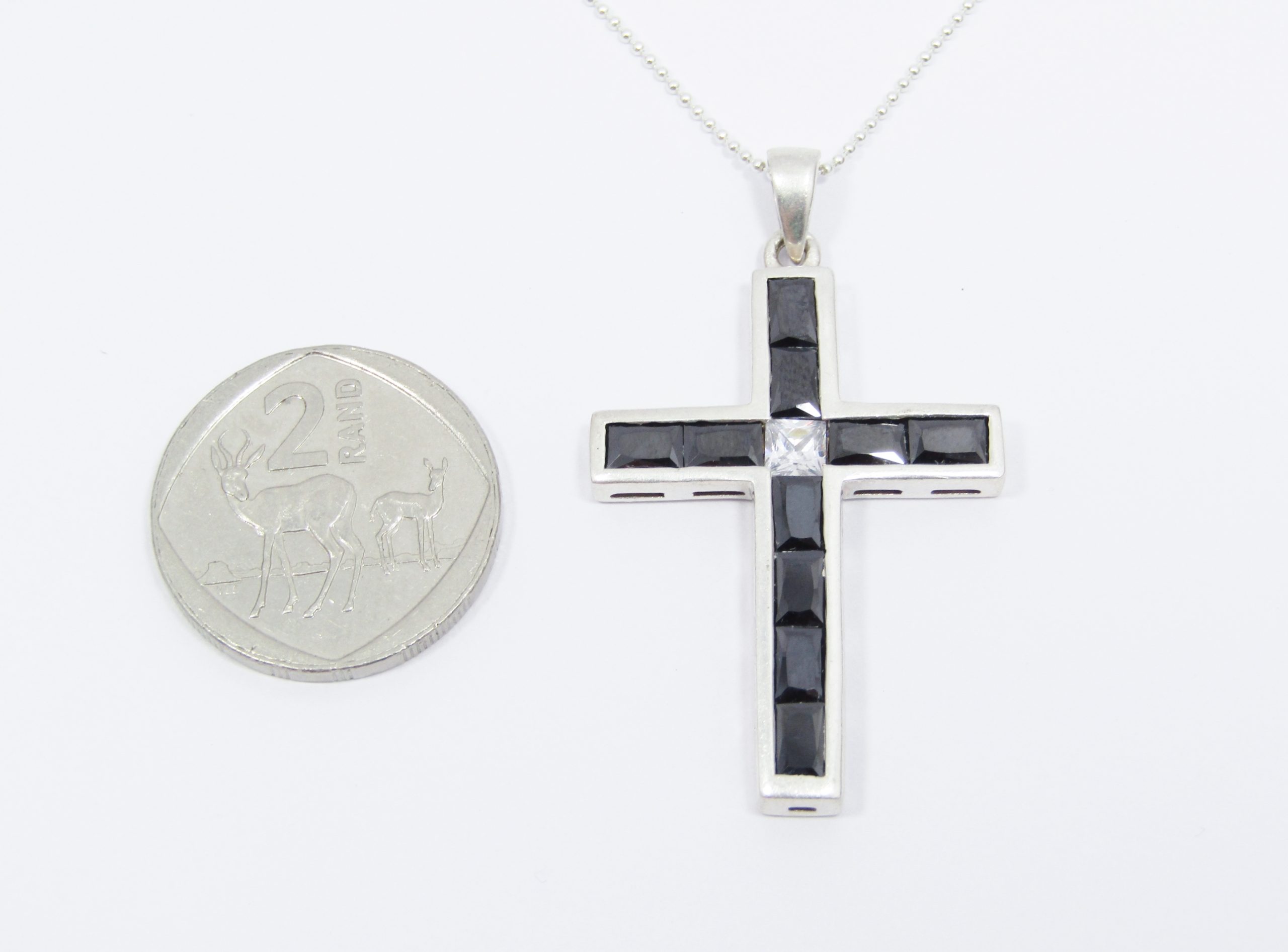 A Lovely Black Stone Zirconia Cross Pendant on Chain in Sterling Silver