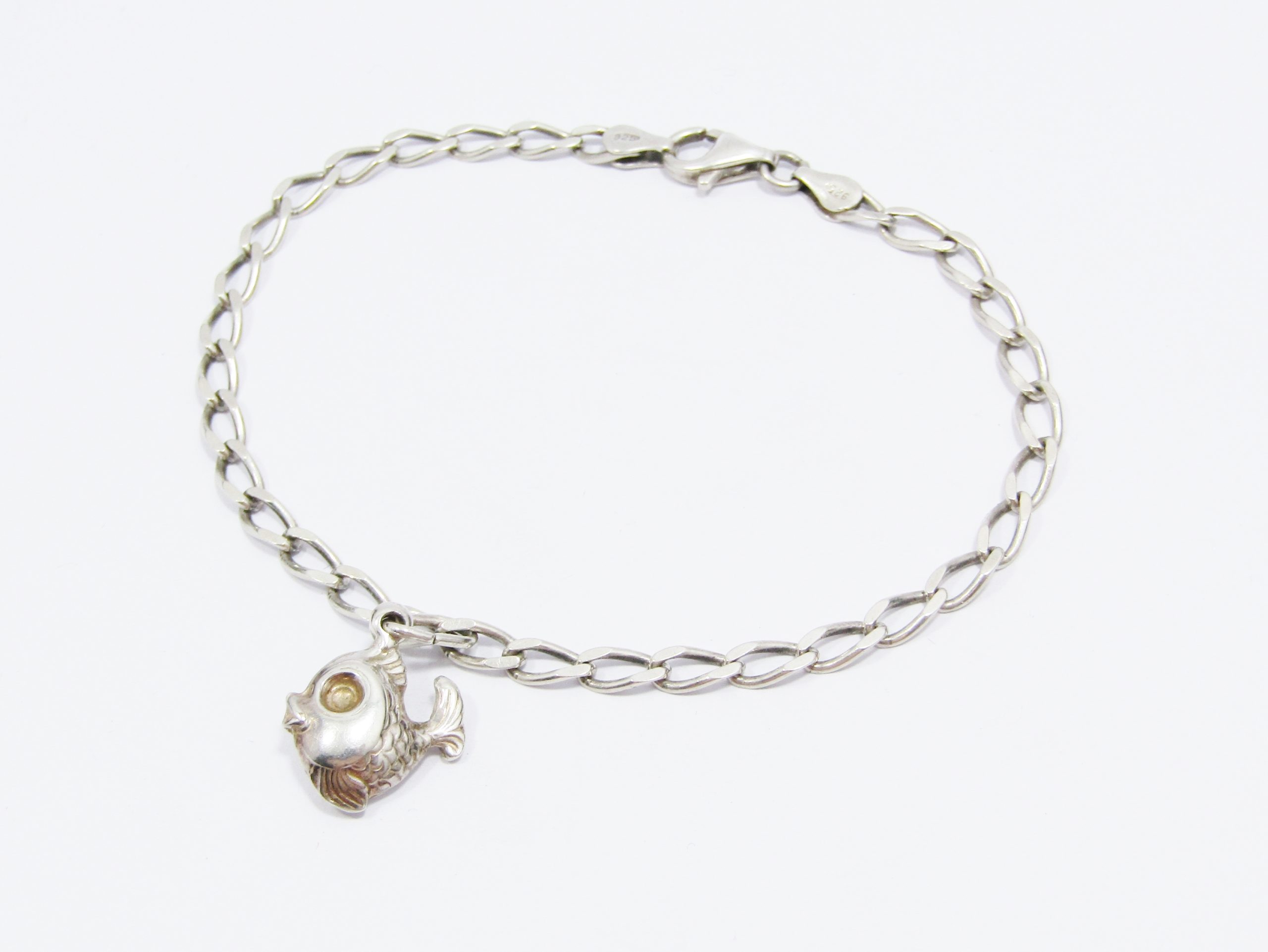 A Lovely Flat link Bracelet With a Puffy Fish Charm in Sterling Silver