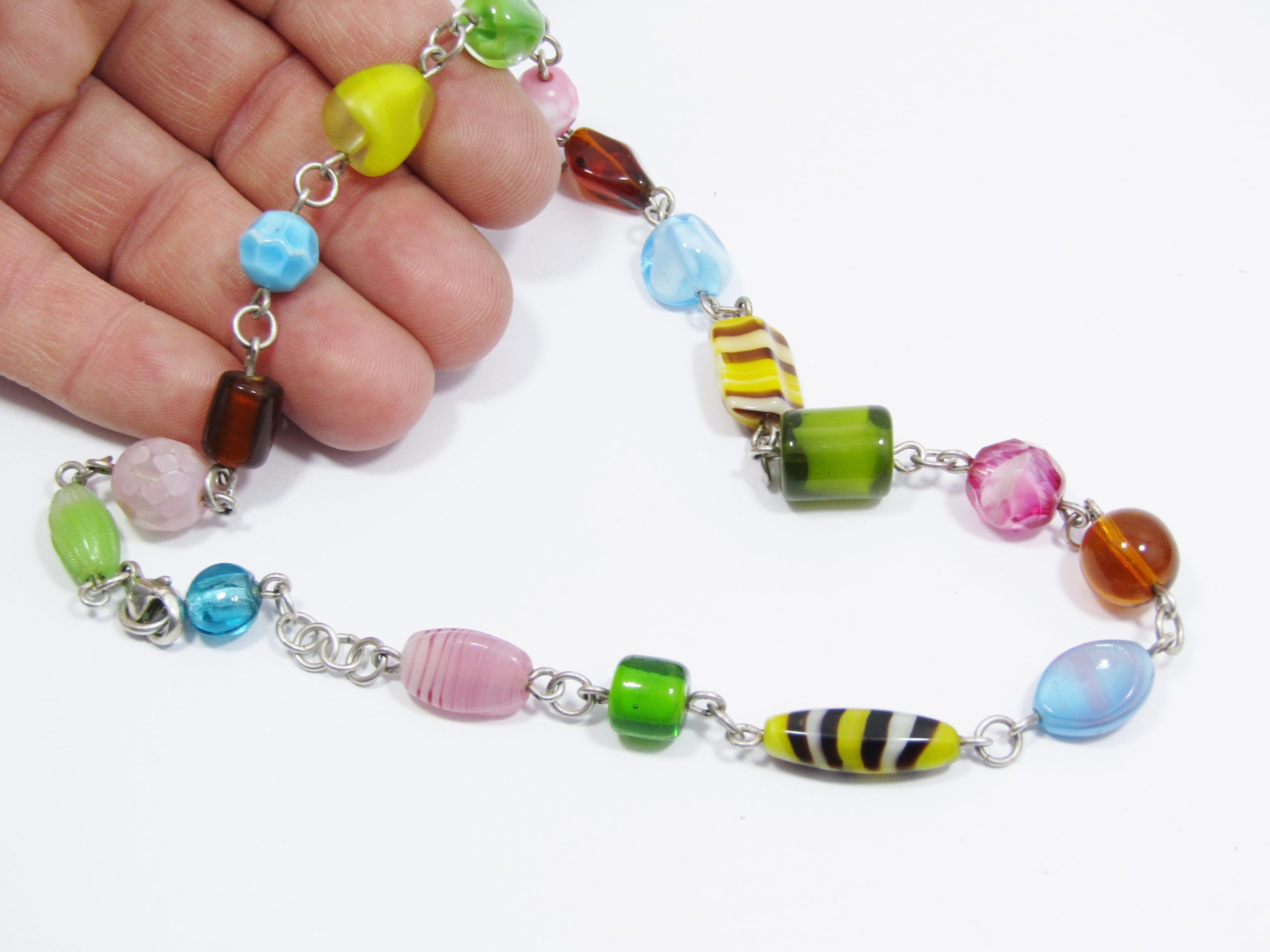 A Stunning String of Art Glass Necklace with Sterling Silver Links and Clasp