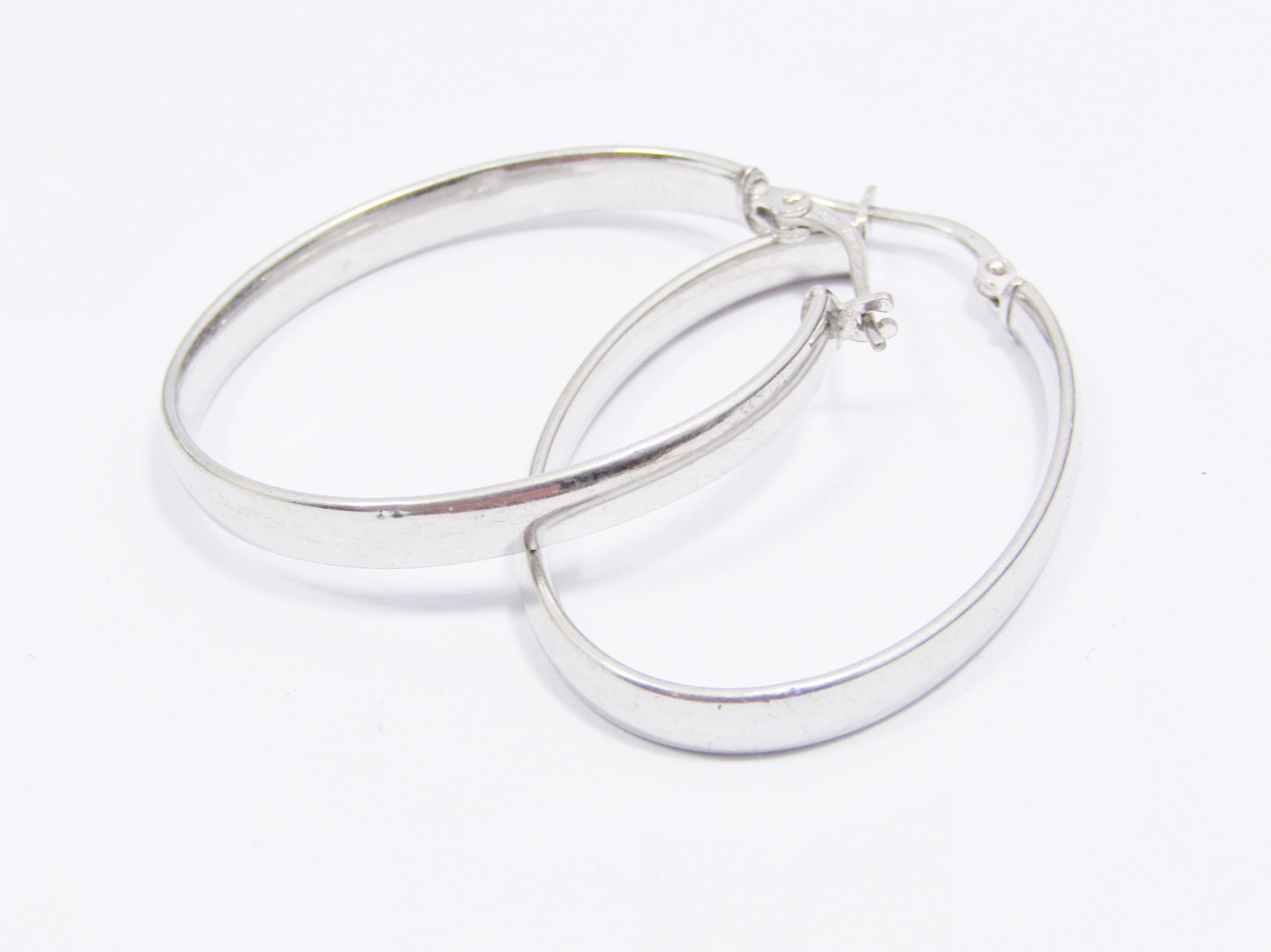 A Stunning Pair of Large Oval Flat Earrings in Sterling Silver
