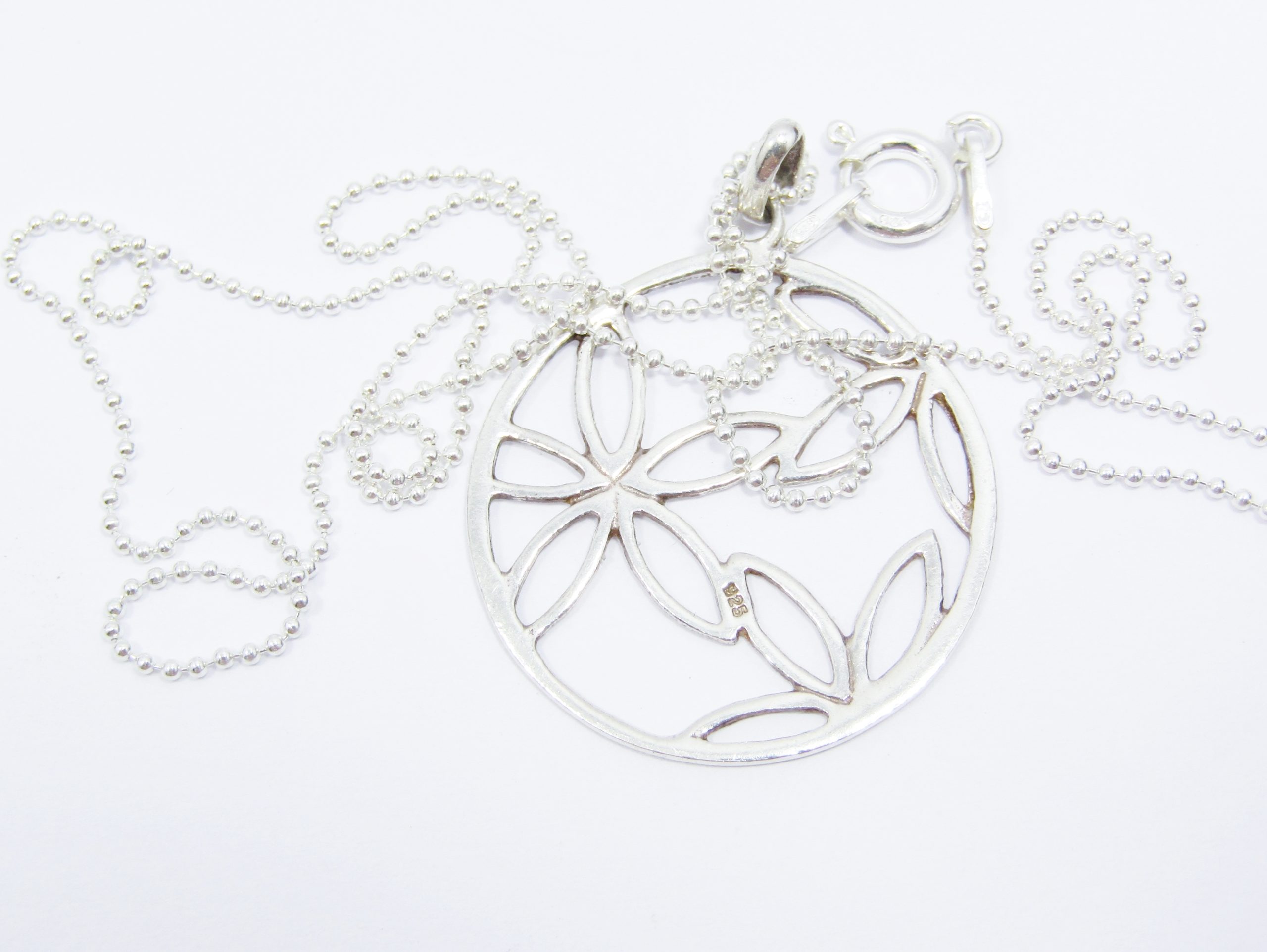 A Stunning Round cut out flower Pendant on chain in Sterling Silver.