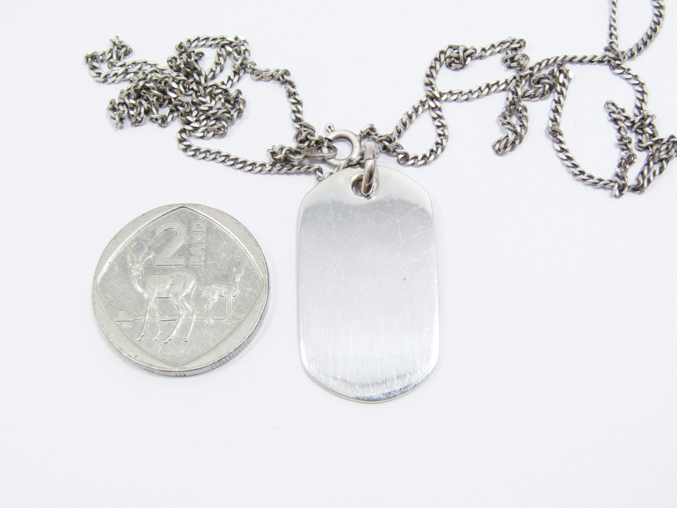 A Stunning Dog tag Pendant on Chain in Sterling Silver.