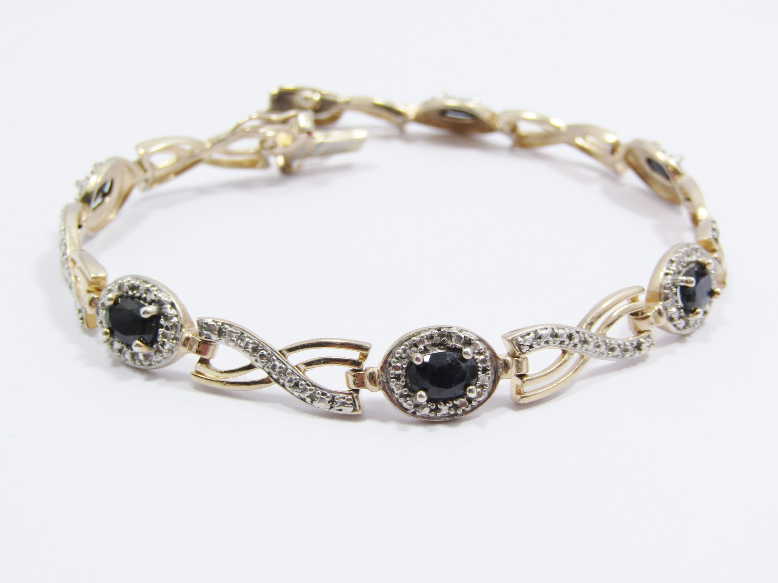 A Stunning Ornate Gold Plated Over Sterling Silver Opaque Sapphires and Clear Zirconia Tennis Bracelet