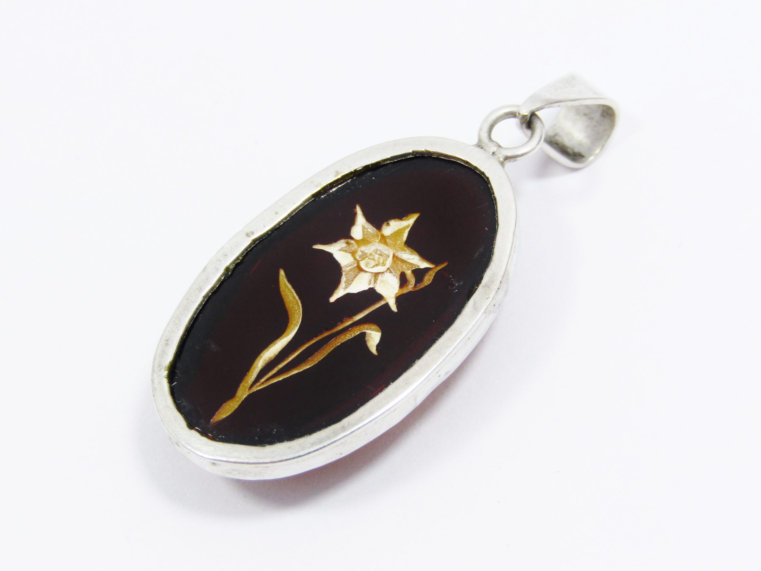 A Stunning Oval Resin Flower Pendant in Sterling Silver