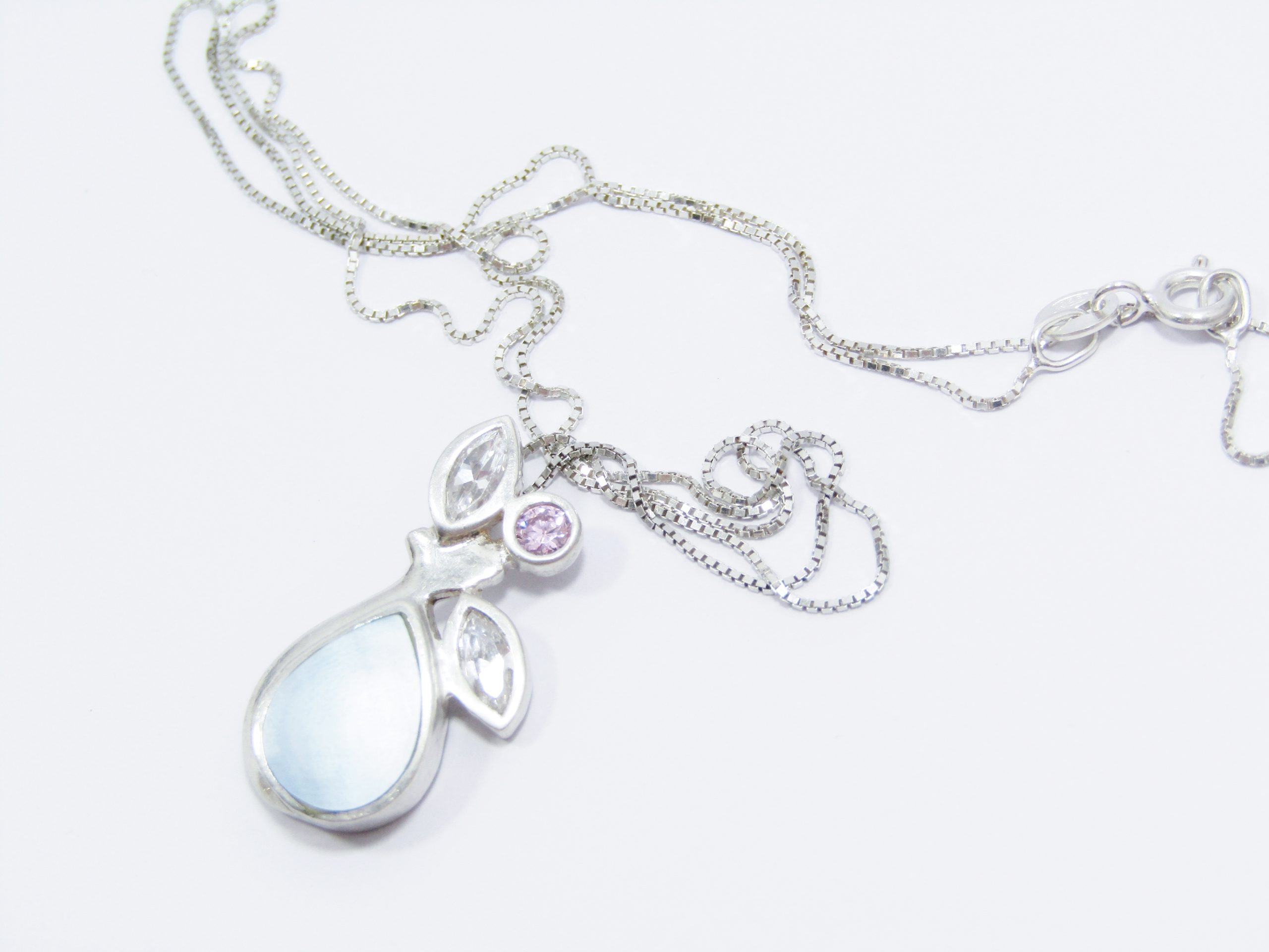 A Gorgeous Multi Color Zirconia and Mother of Pearl Pendant on Chain in Sterling Silver.