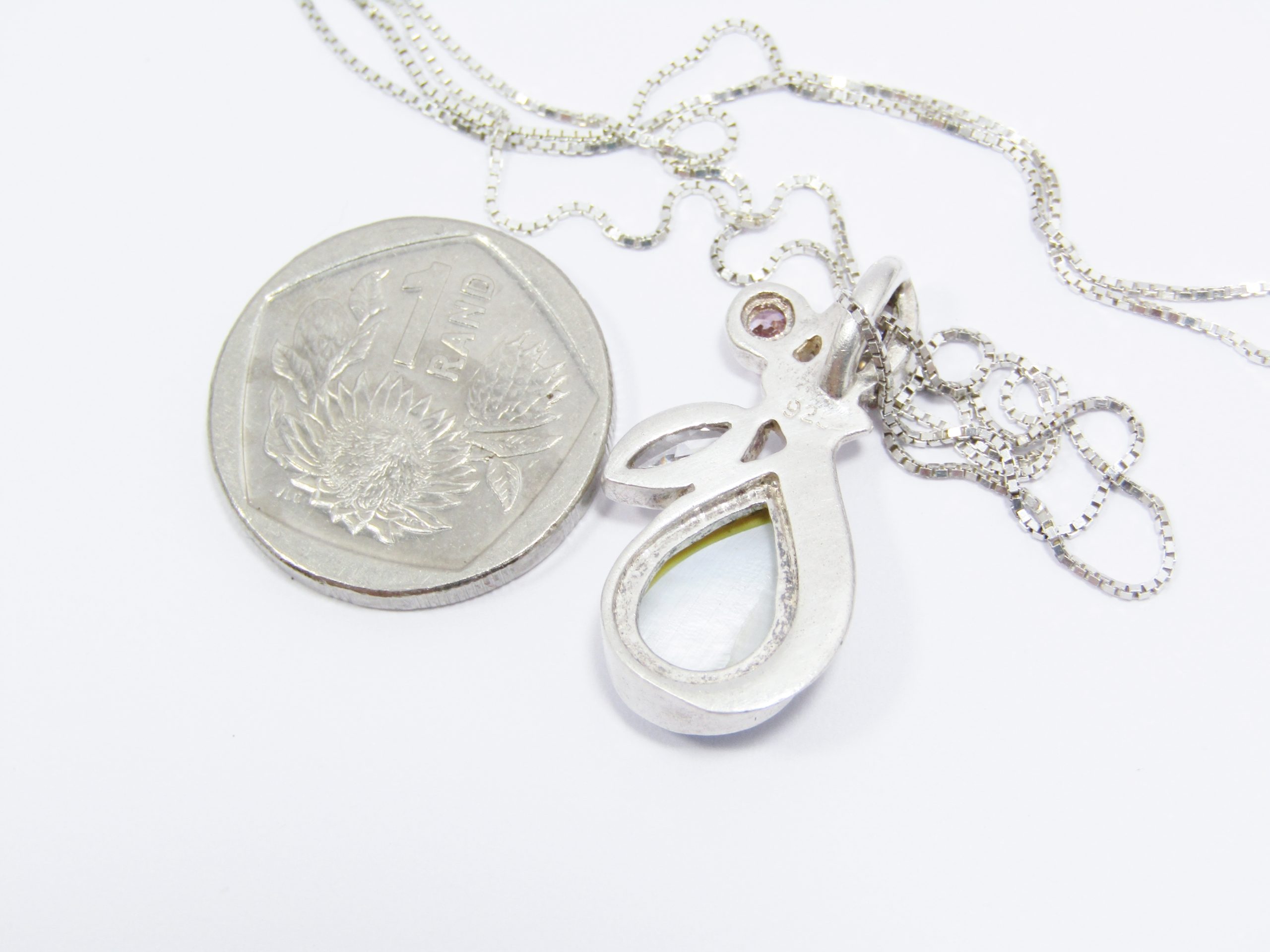 A Gorgeous Multi Color Zirconia and Mother of Pearl Pendant on Chain in Sterling Silver.