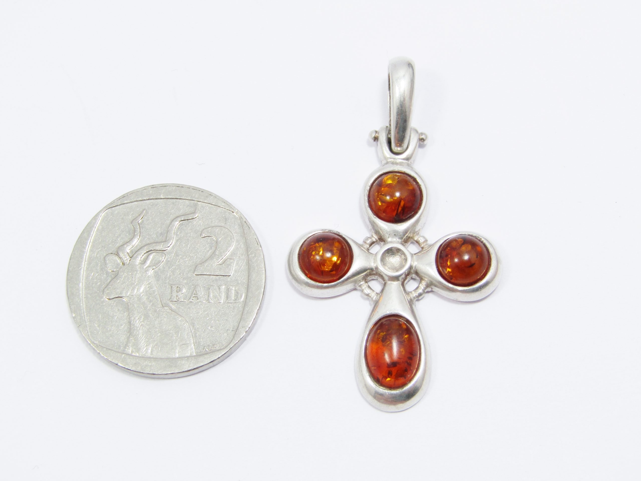 A Beautiful Amber Cross Pendant in Sterling Silver