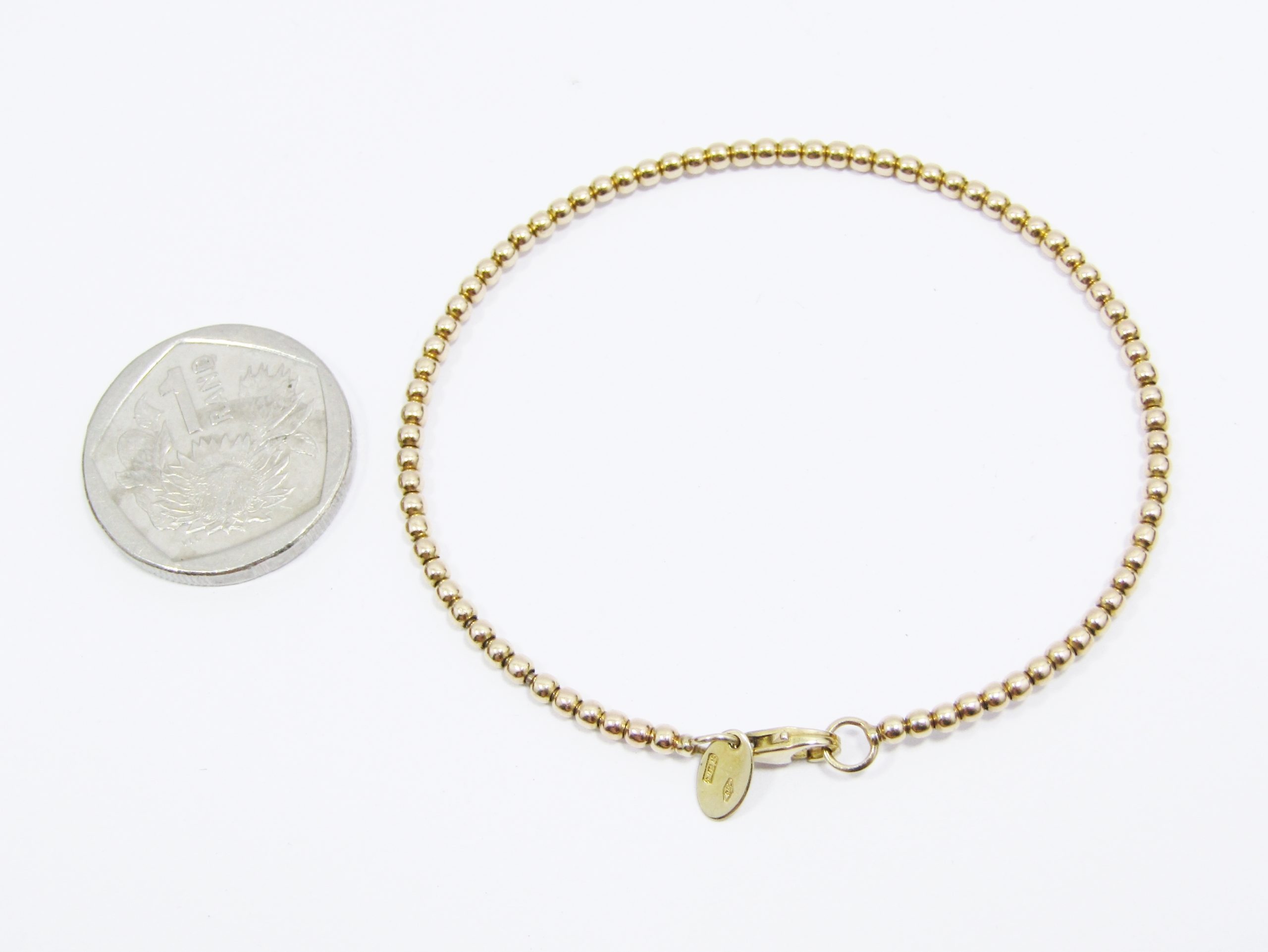 A Gorgeous Ball Stack Bangle in 9ct Gold With Italian hallmarks