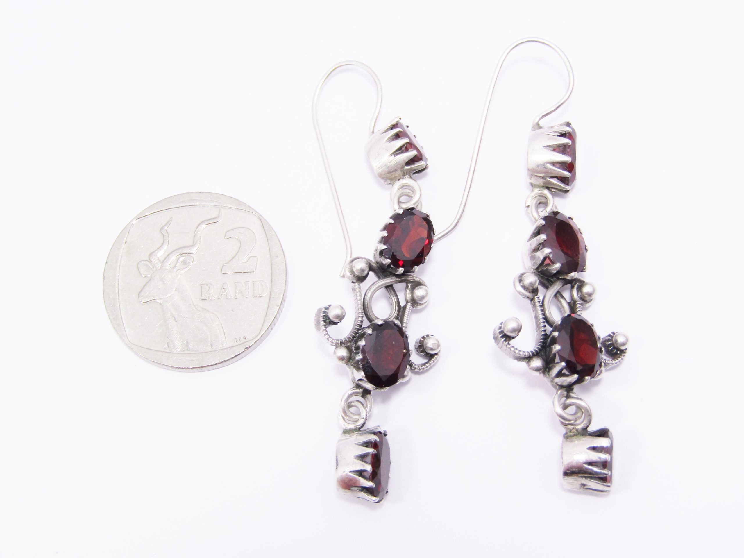 A Gorgeous Pair of Detailed Garnet Dangling Earrings in Sterling Silver.