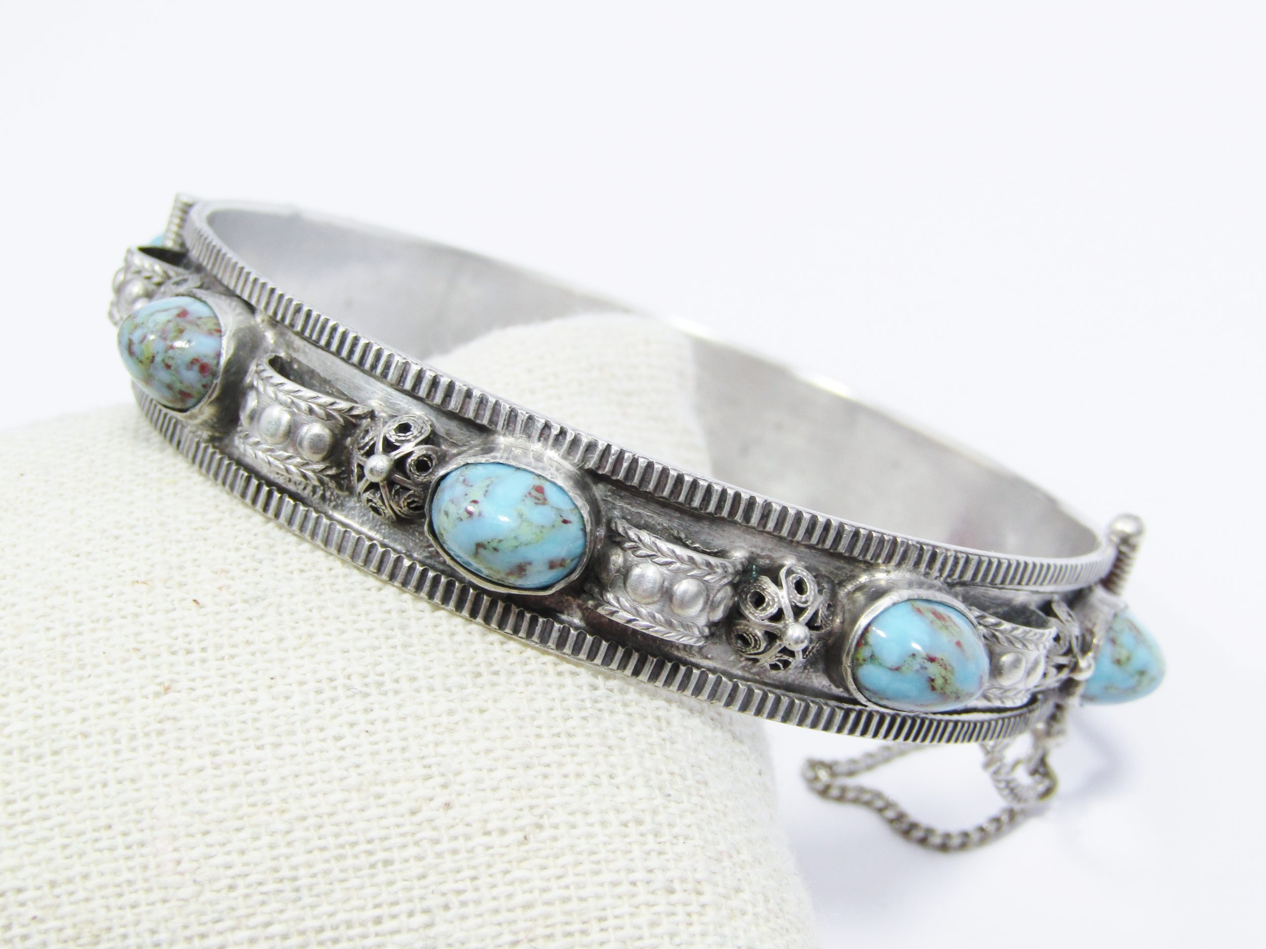 A Beautiful Egyptian Style Hinged Bangle with Are Glass inserts in 800 Silver