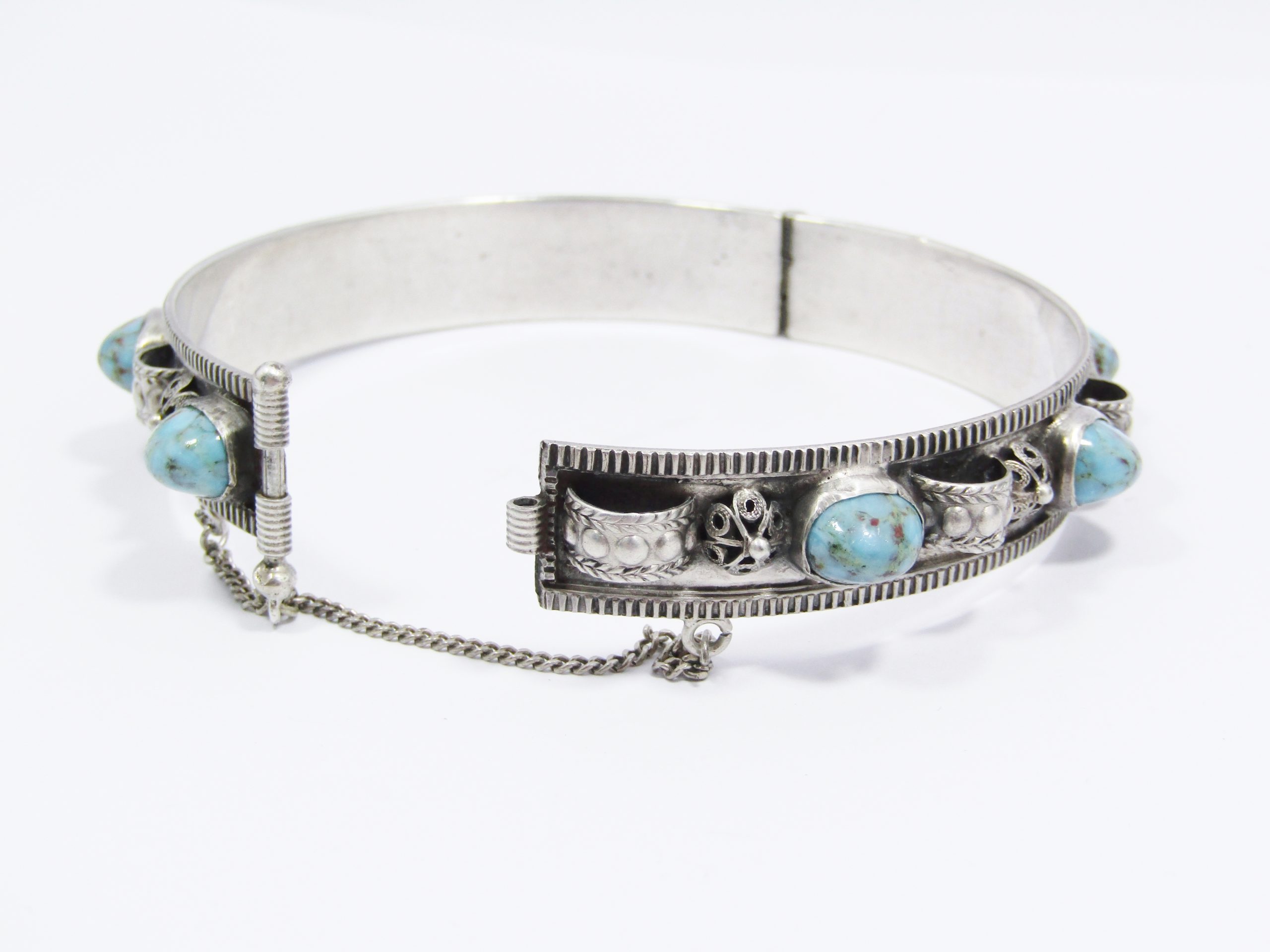 A Beautiful Egyptian Style Hinged Bangle with Are Glass inserts in 800 Silver