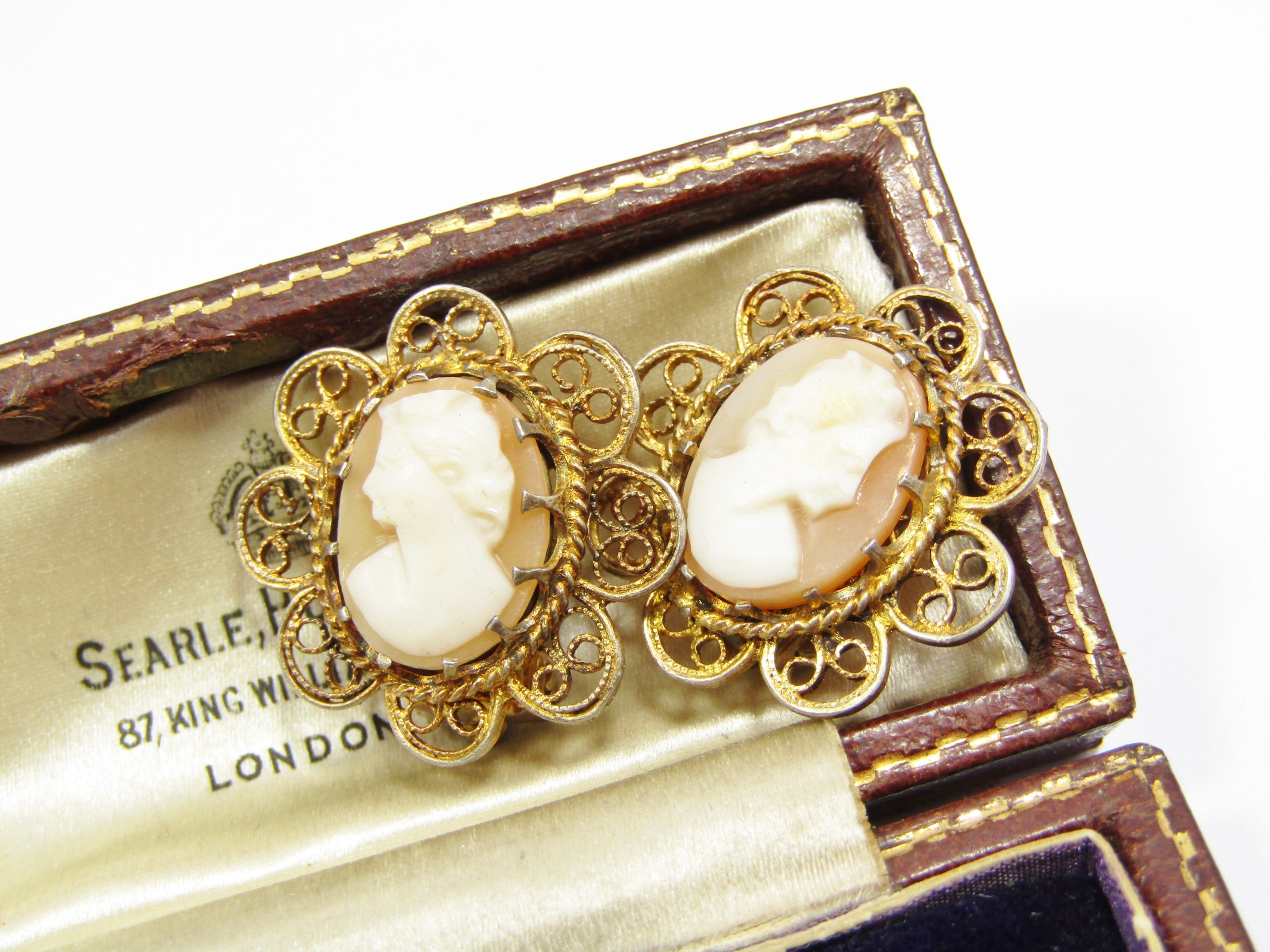 A Gorgeous Pair of Rolled Gold Over Sterling Siler Filigree Craved Cameo Clip on Earrings in Sterling Silver.