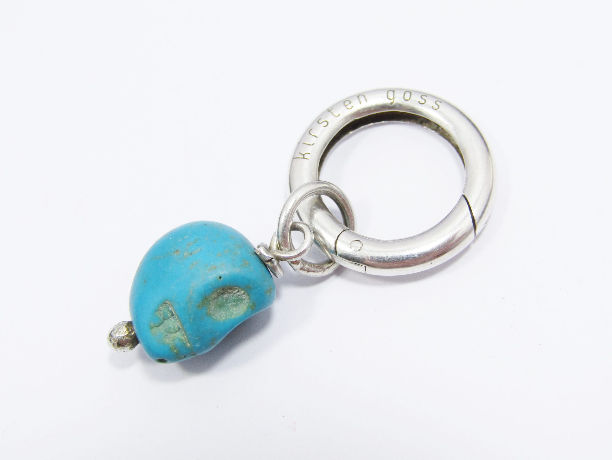 A Lovely Kirsten Goss Blue Stone Pendant Carved in a skull design in Sterling Silver