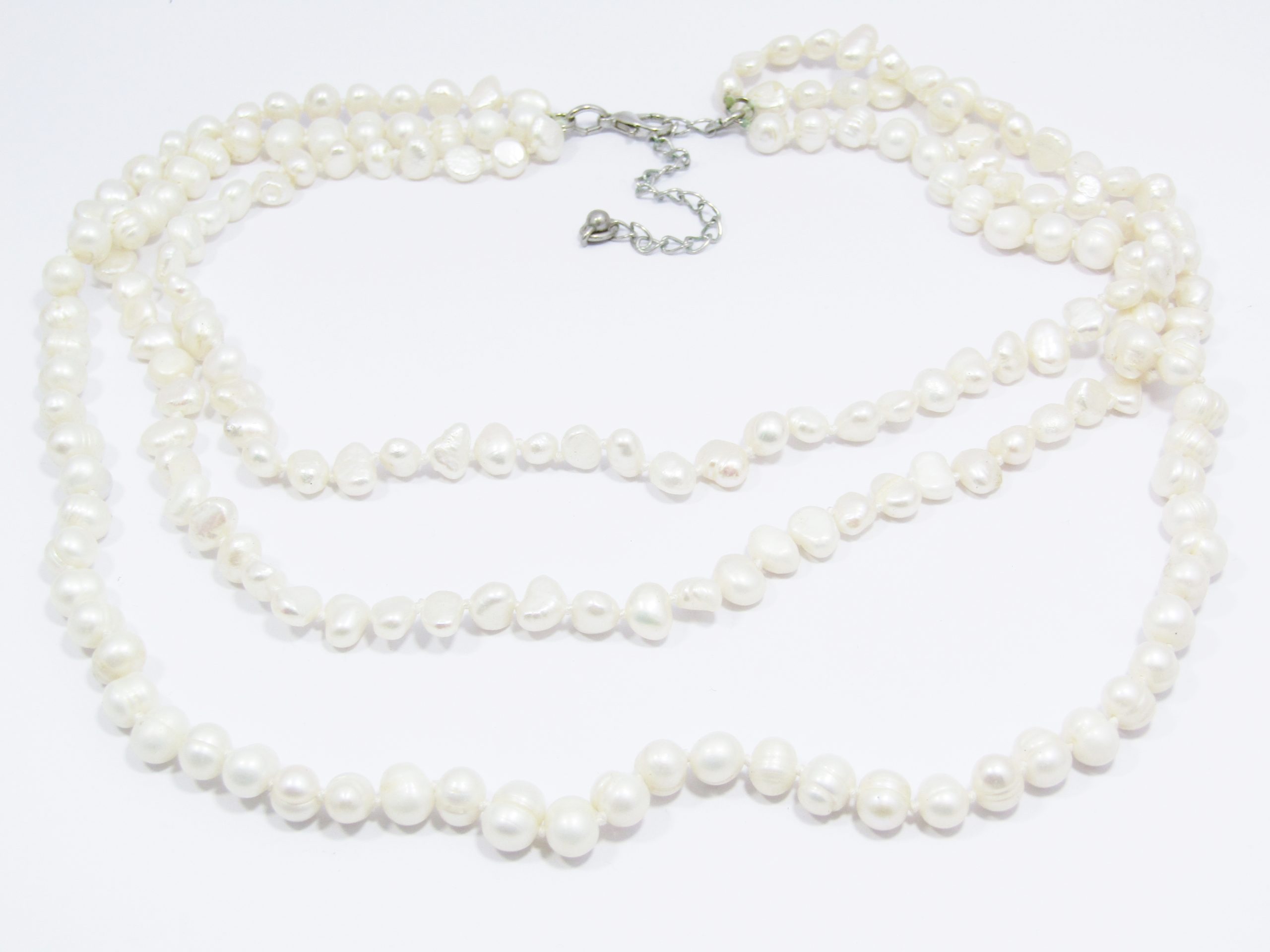 A Gorgeous Layered Three Strand Fresh Water Pearl Necklace with a Silver Tone Clasp
