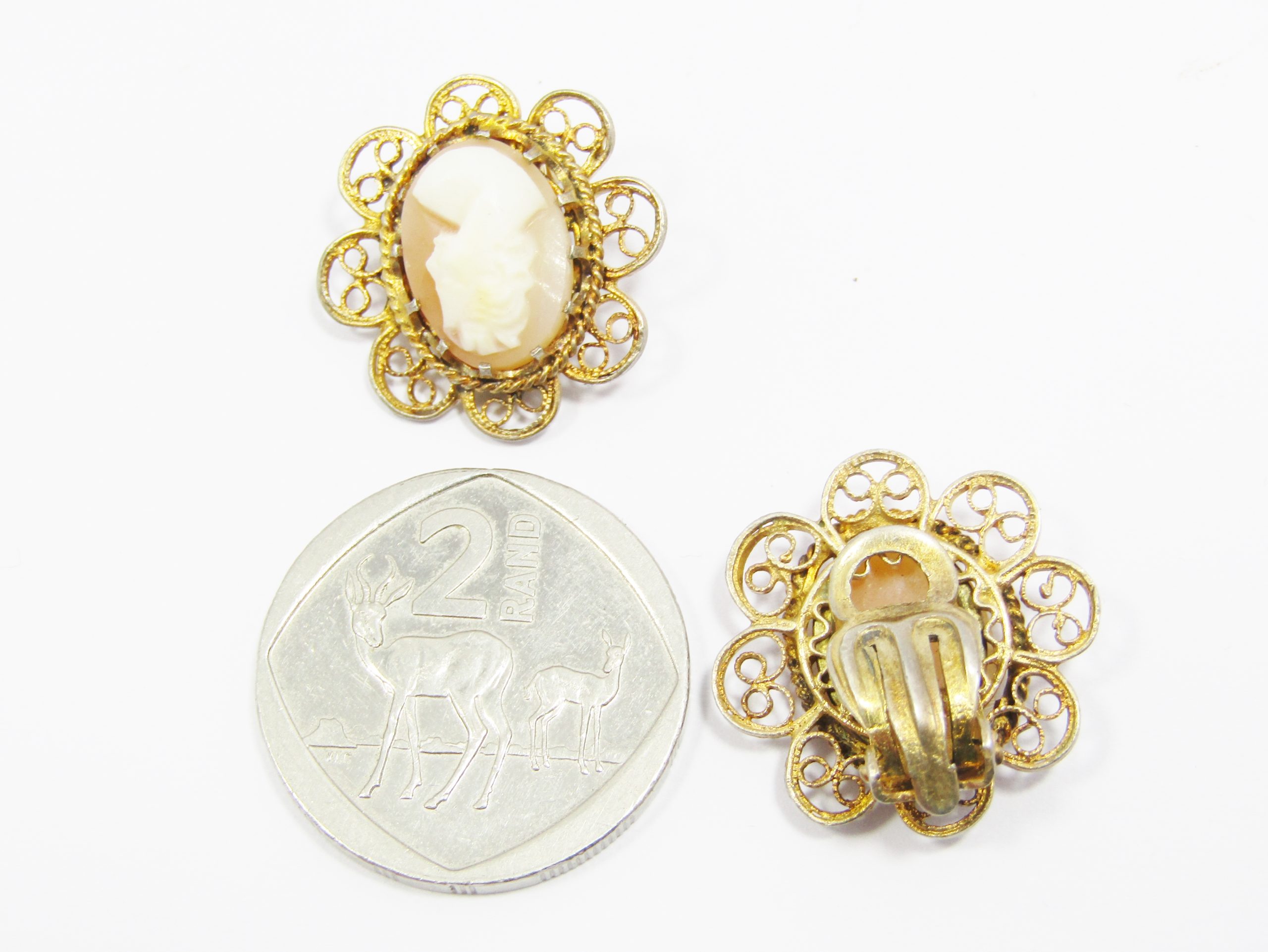 A Gorgeous Pair of Rolled Gold Over Sterling Siler Filigree Craved Cameo Clip on Earrings in Sterling Silver.