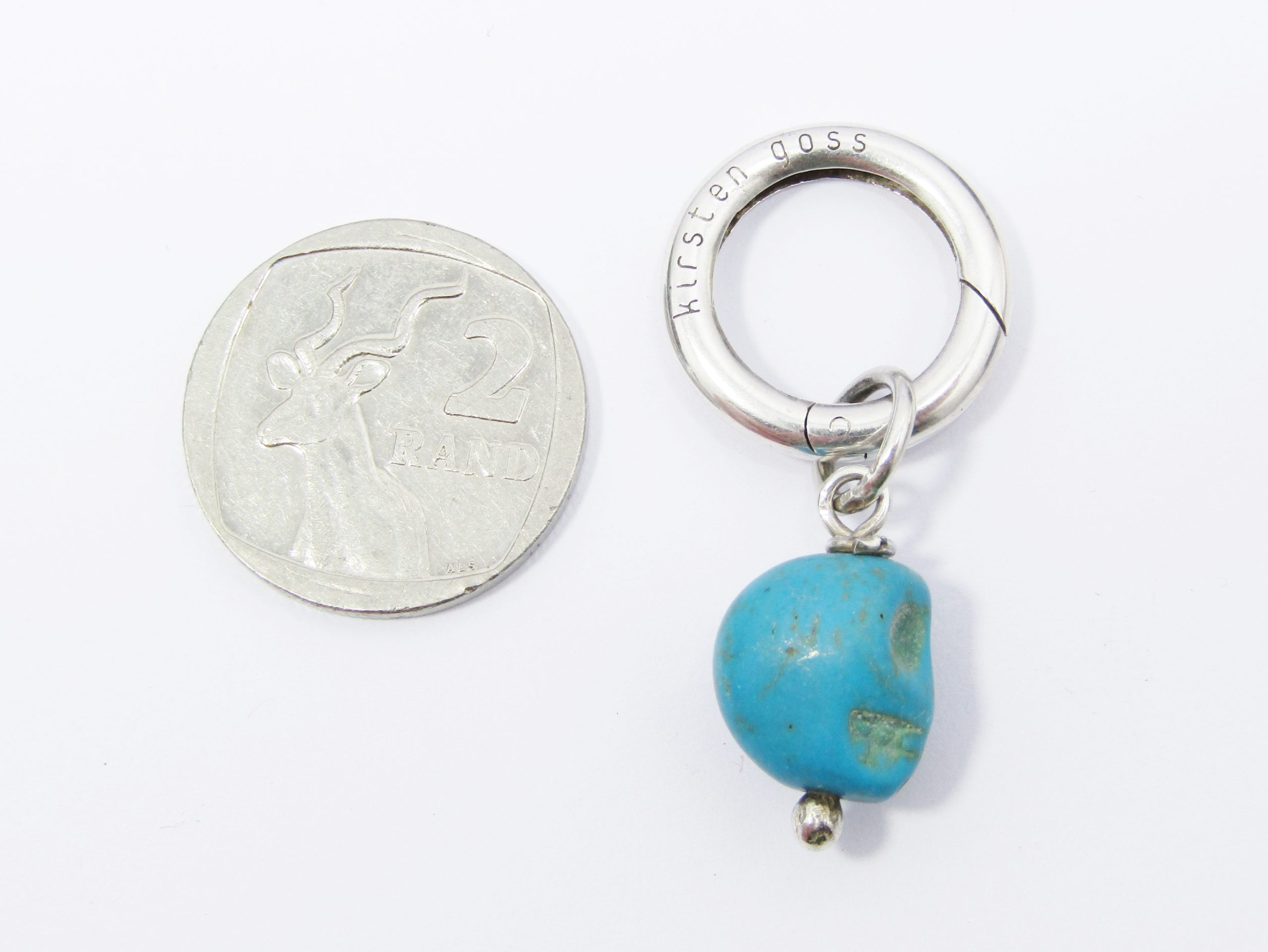 A Lovely Kirsten Goss Blue Stone Pendant Carved in a skull design in Sterling Silver