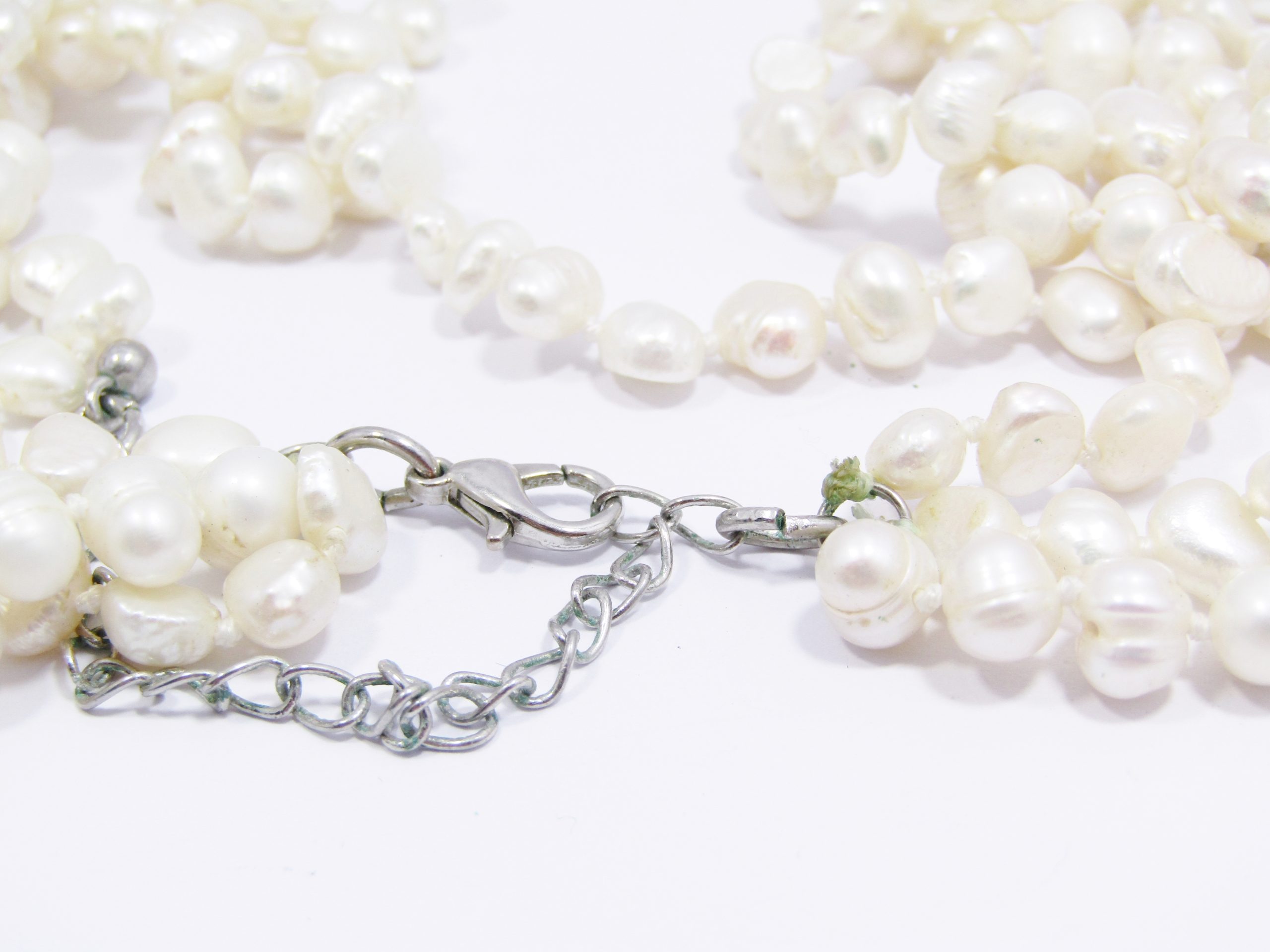 A Gorgeous Layered Three Strand Fresh Water Pearl Necklace with a Silver Tone Clasp