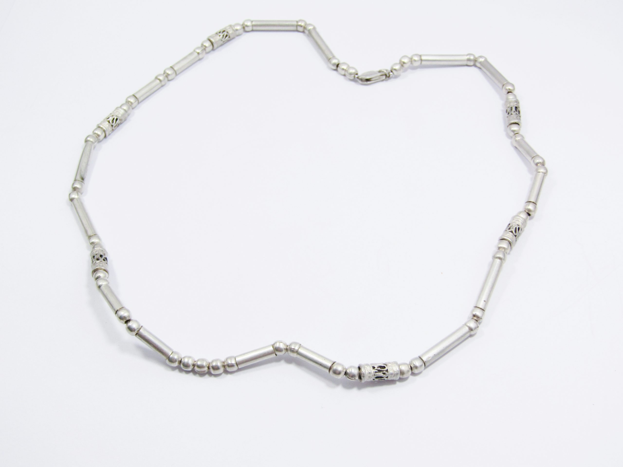 A Lovely Textured Paneled ball Necklace in Sterling Silver.